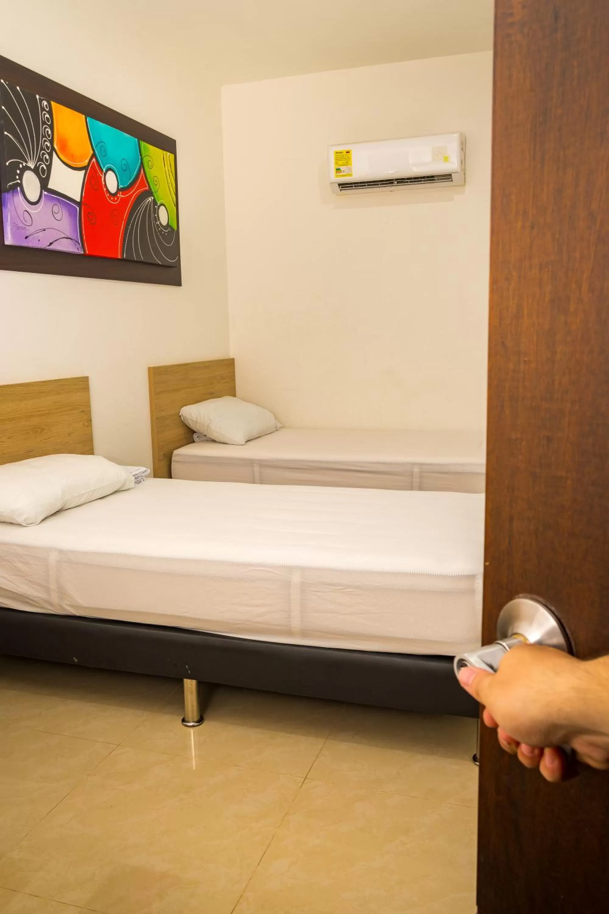 Bed in Genesis Hotel