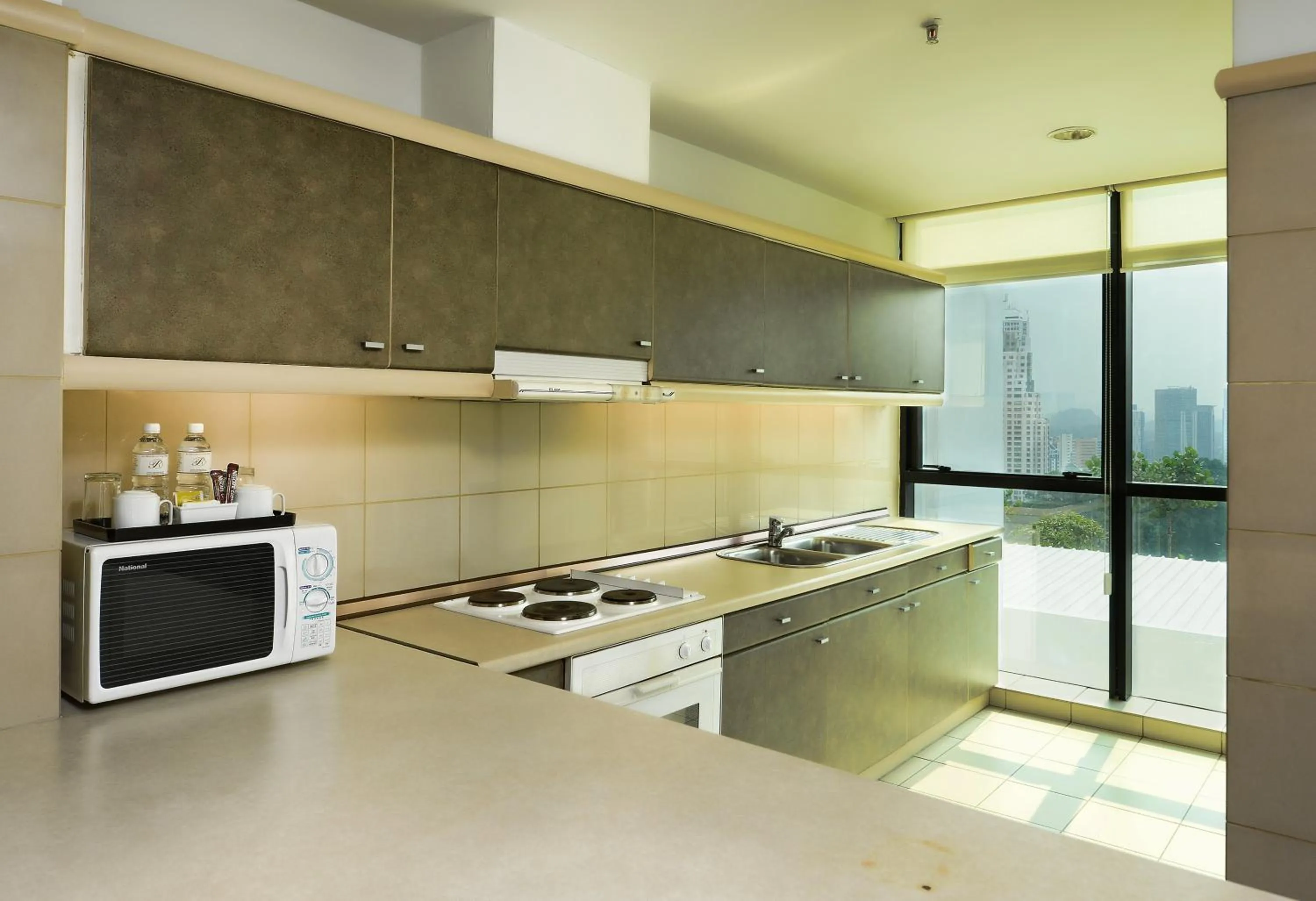 Kitchen or kitchenette in Pacific Regency Hotel Suites
