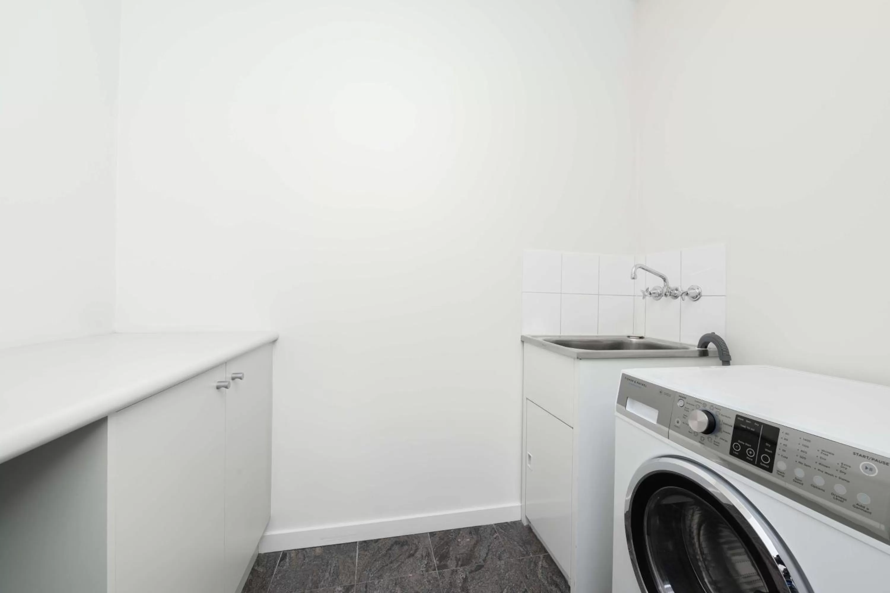 washing machine in Adina Apartment Hotel Melbourne Flinders Street