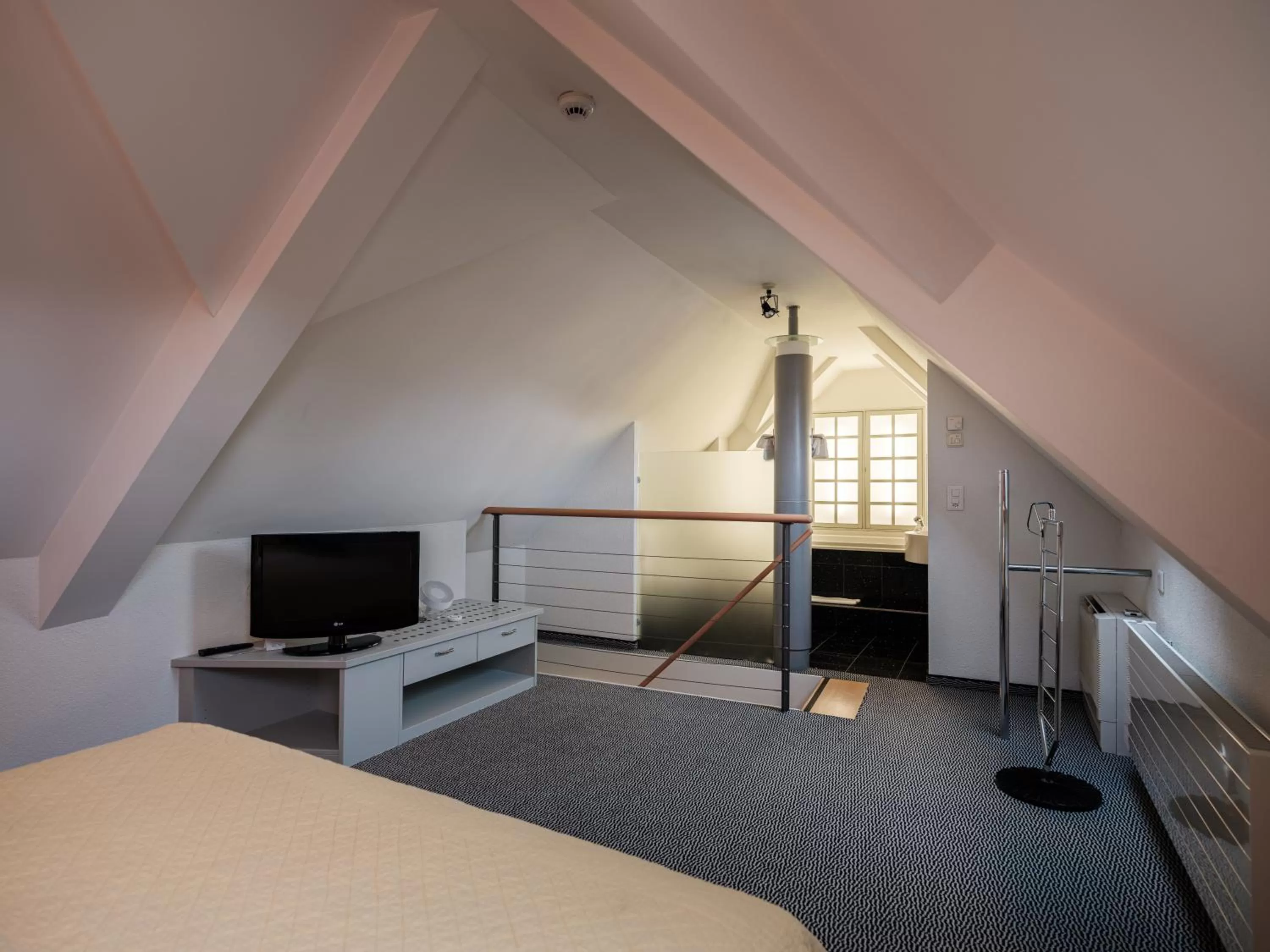 Living room, Bed in HOTEL ENGEL LIESTAL - Business & Lifestyle