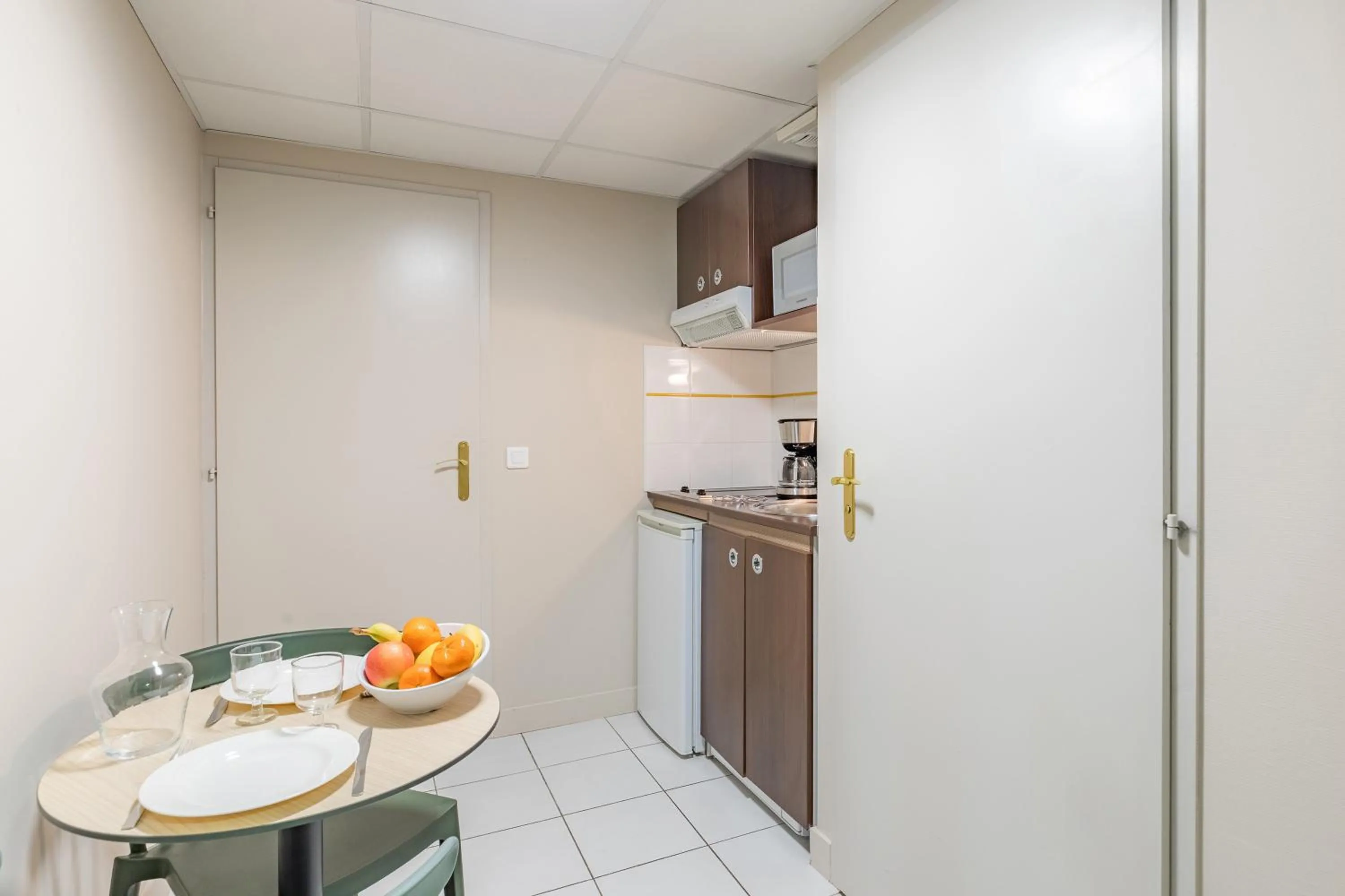 Kitchen or kitchenette in Appart'City Confort Agen Centre
