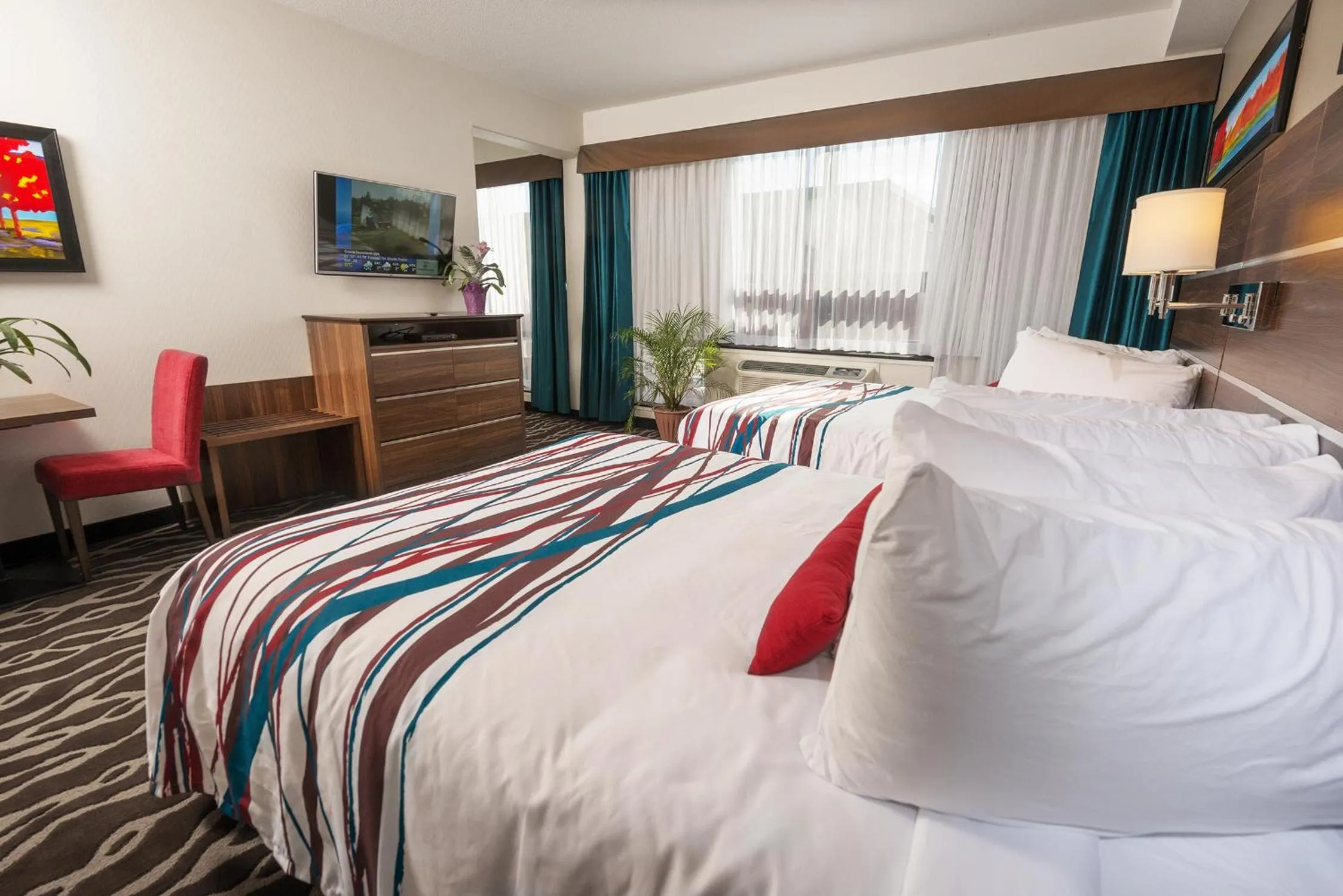 Bedroom, Bed in Encore Suites by Service Plus Inns