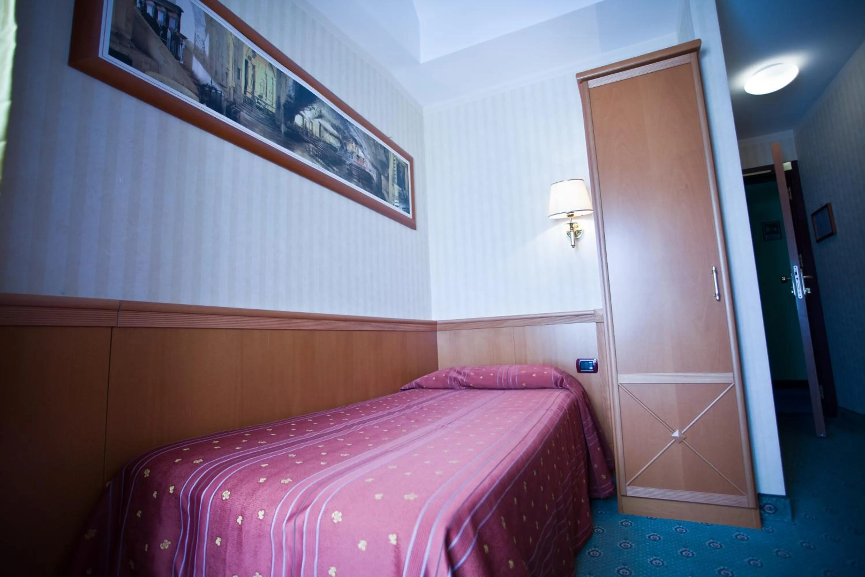 Bed in Palace Hotel San Michele