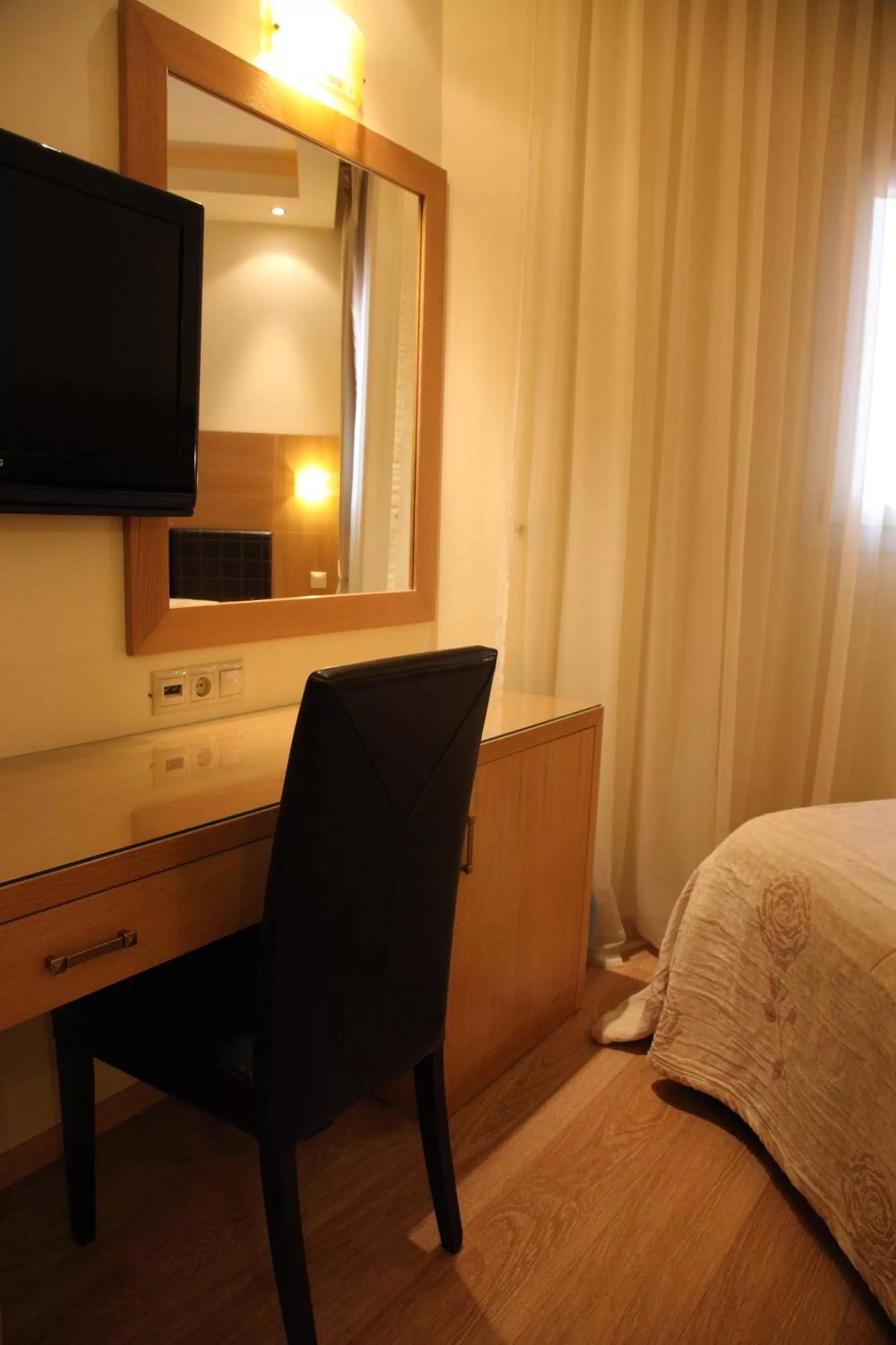 Seating area, Bed in Pantelidis Hotel & Spa