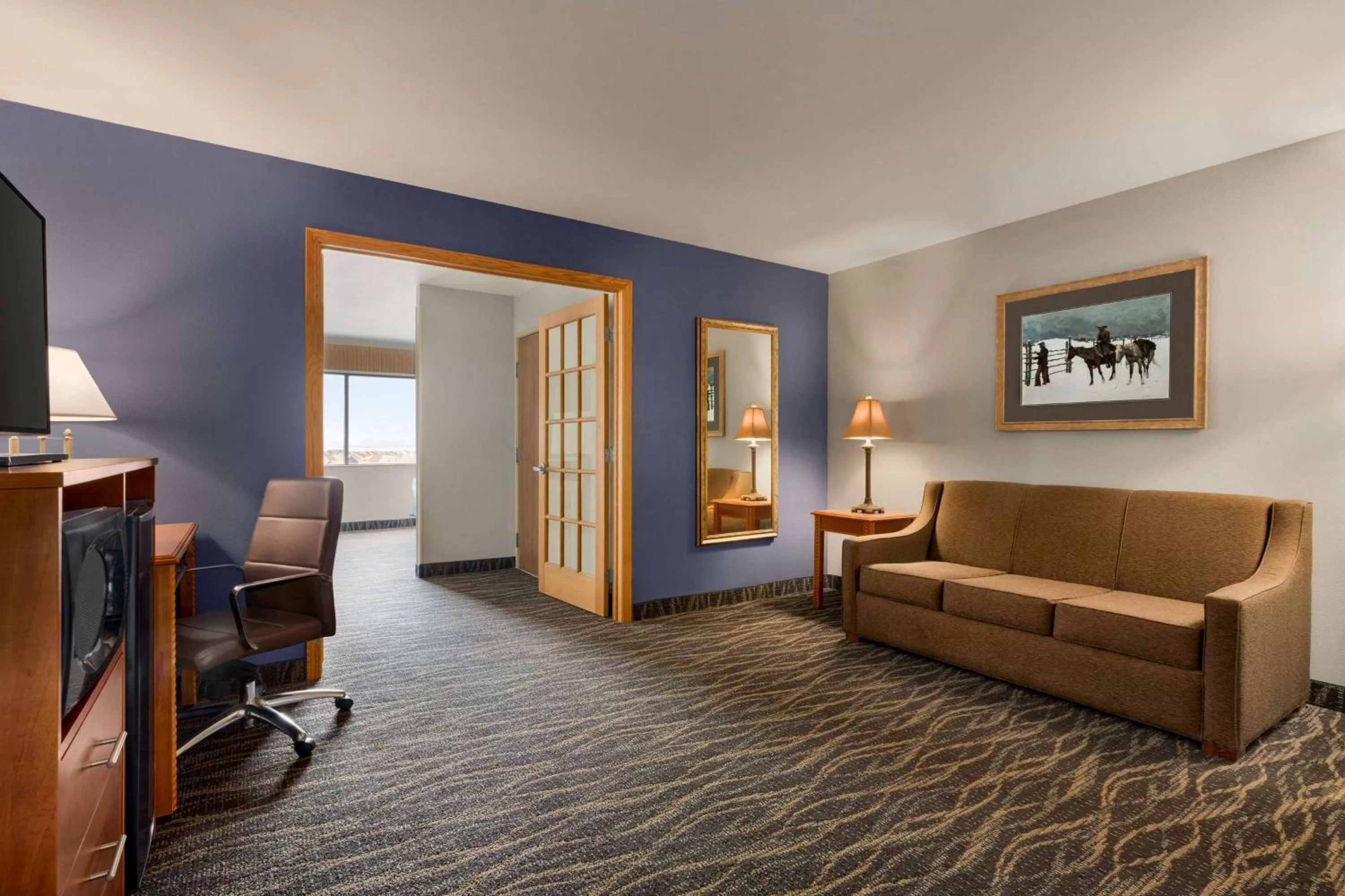 Bed in AmericInn by Wyndham Laramie Near University of Wyoming