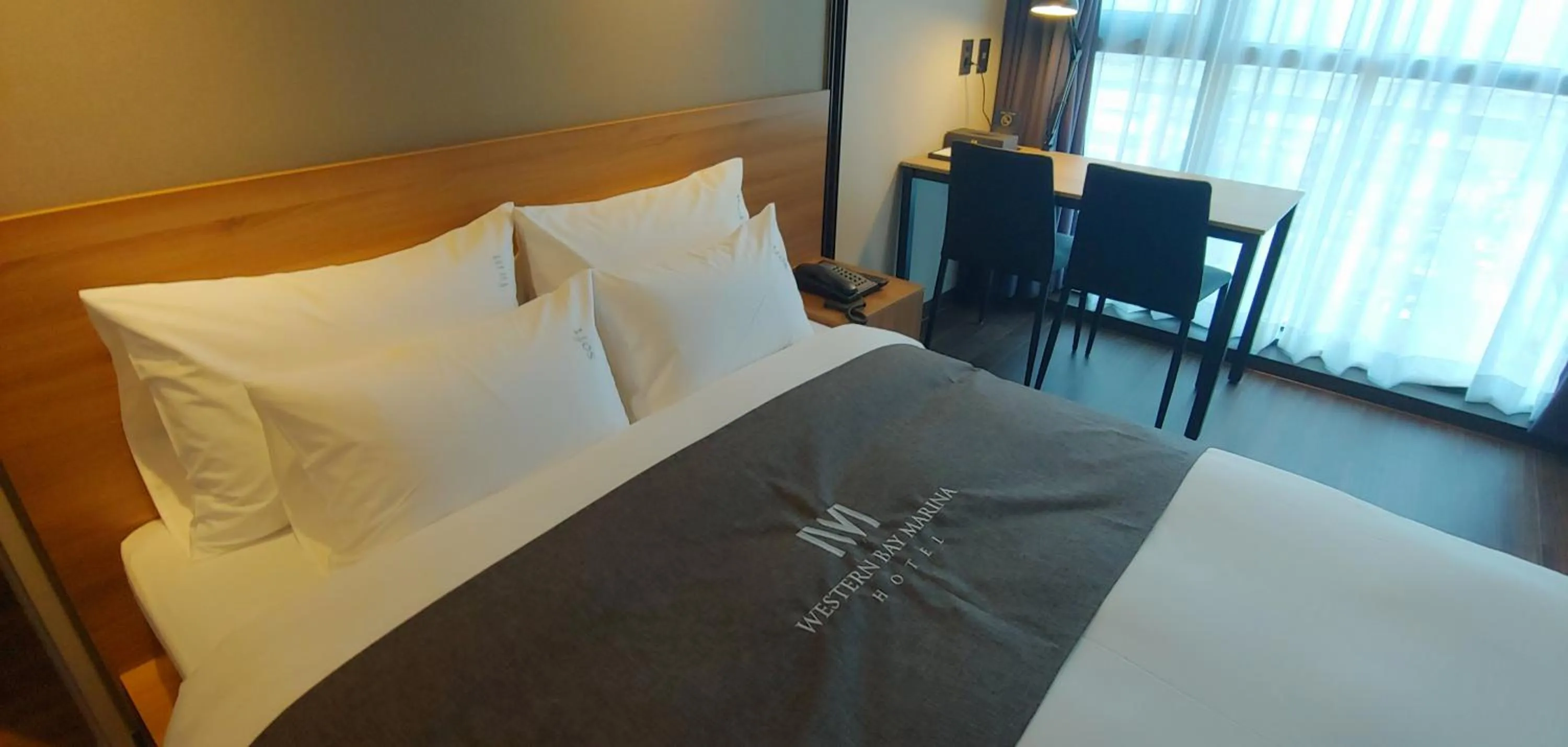 Bed in Western Bay Marina Hotel