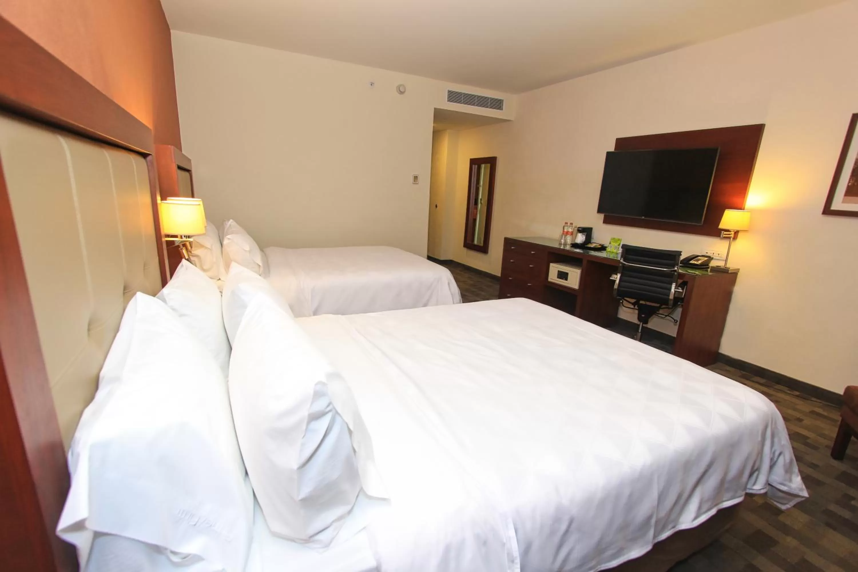 Bed in Holiday Inn & Suites Plaza Mayor by IHG