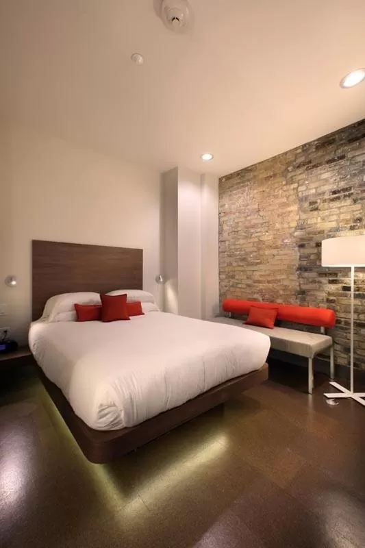 Bed in CityFlatsHotel - Grand Rapids, an Ascend Collection Hotel