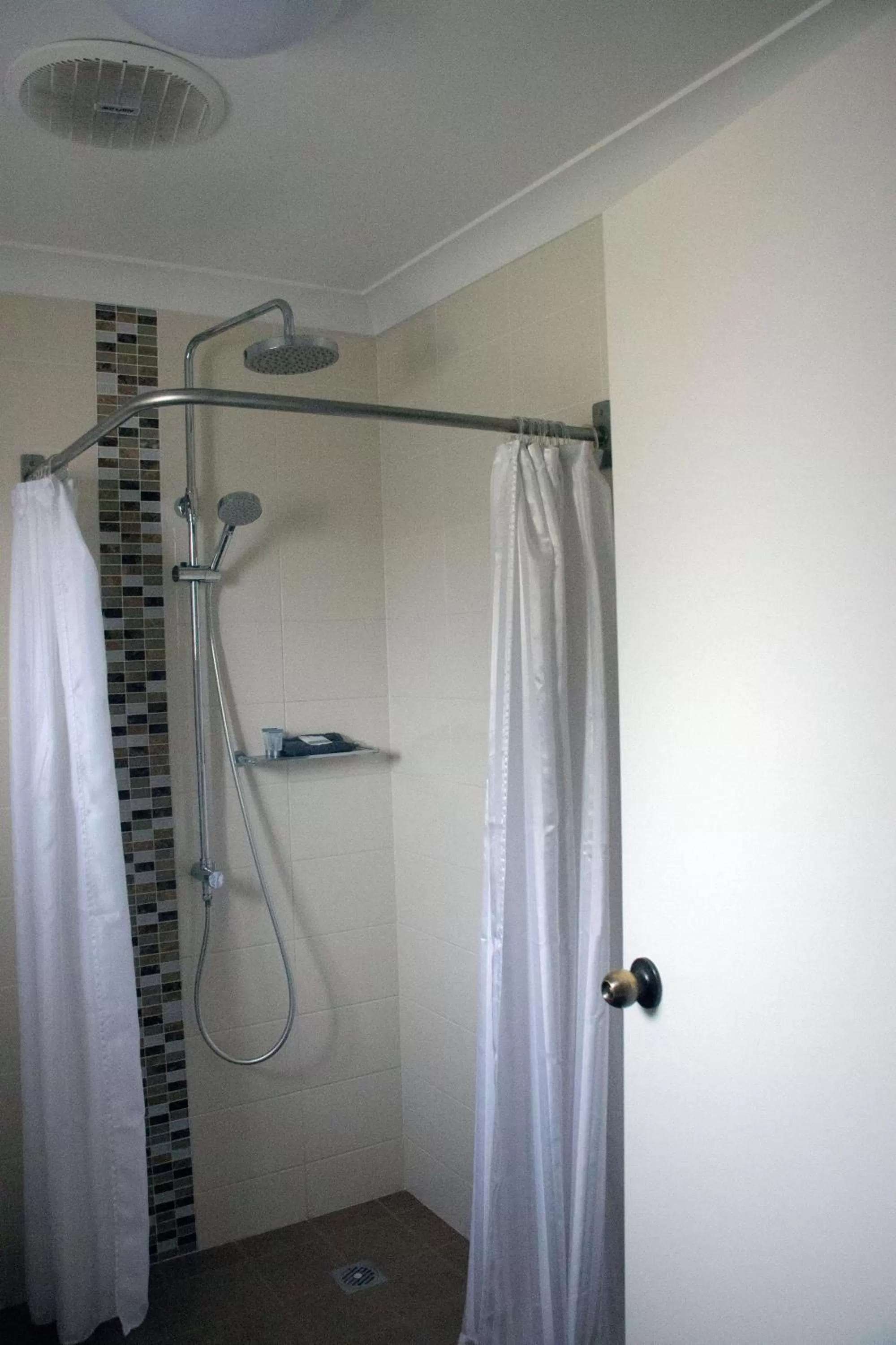 Shower in Highway Inn Motel