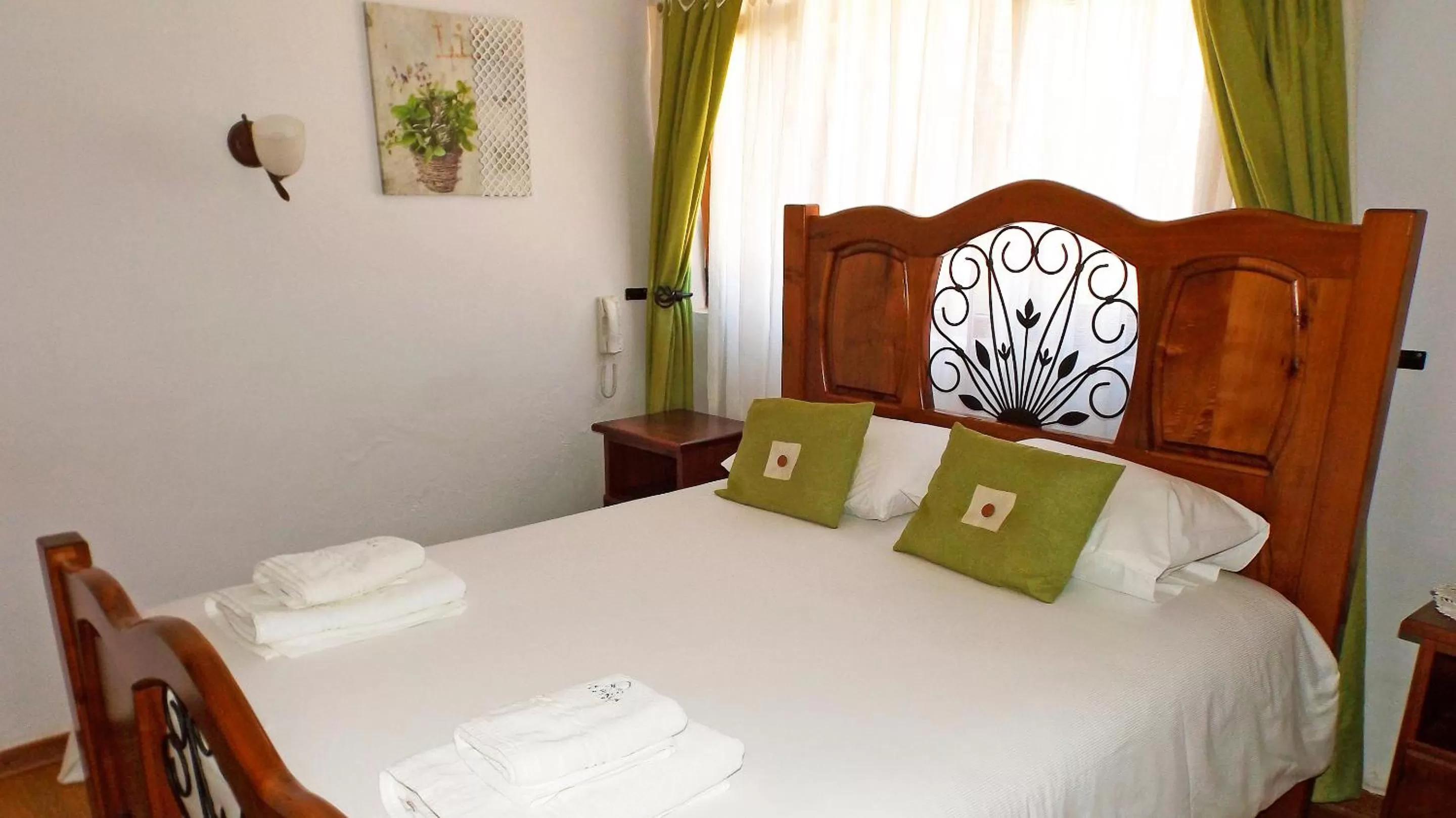 Bed in La Perla Hotel