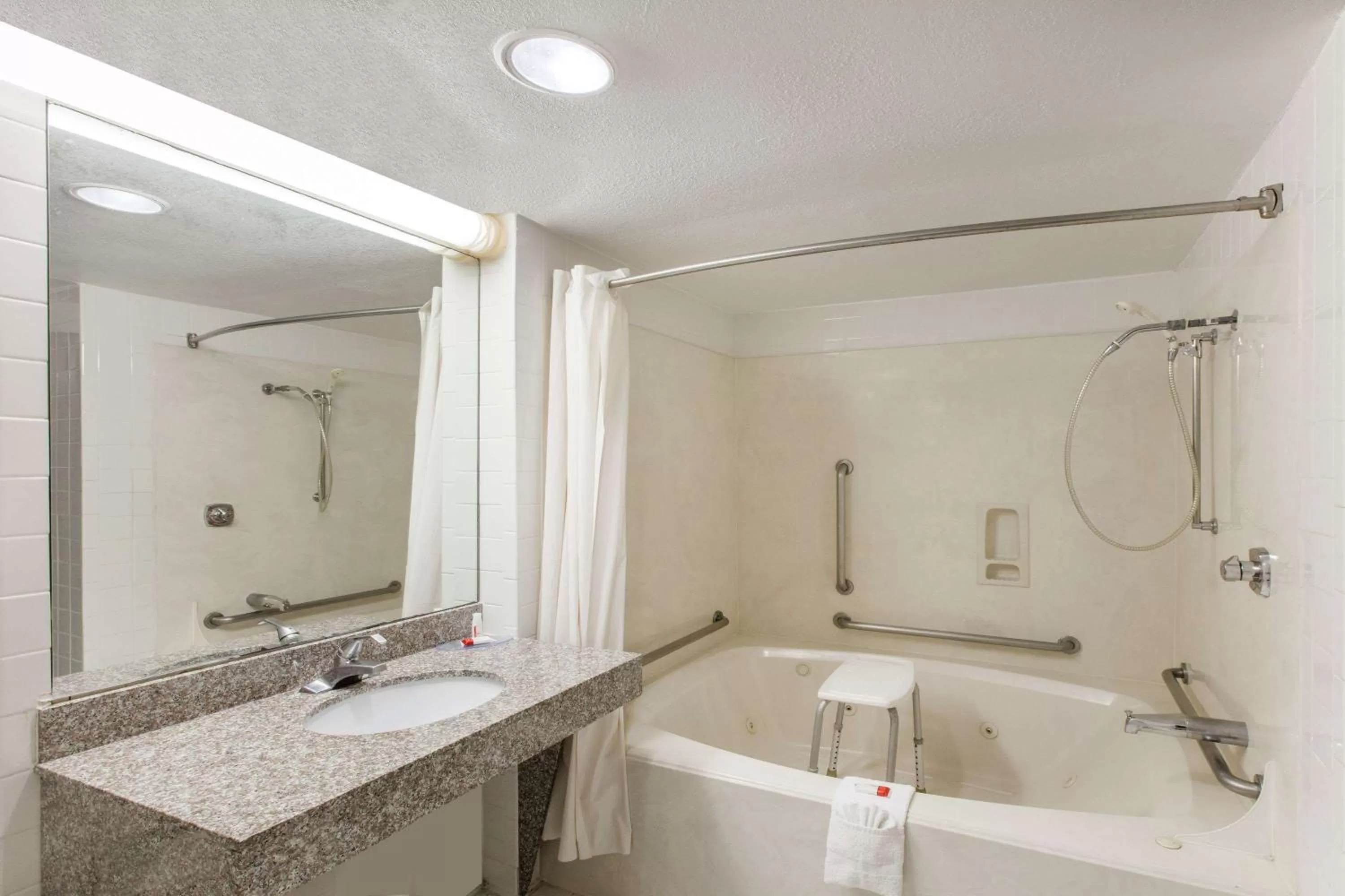 Bathroom in Days Inn & Suites by Wyndham Webster NASA-ClearLake-Houston