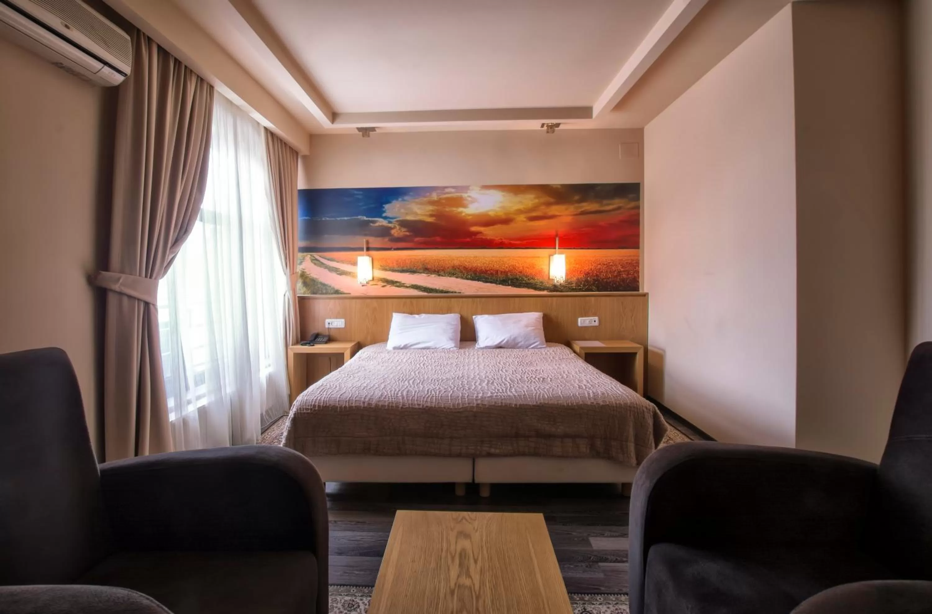 Seating area, Bed in Hotel Lirak