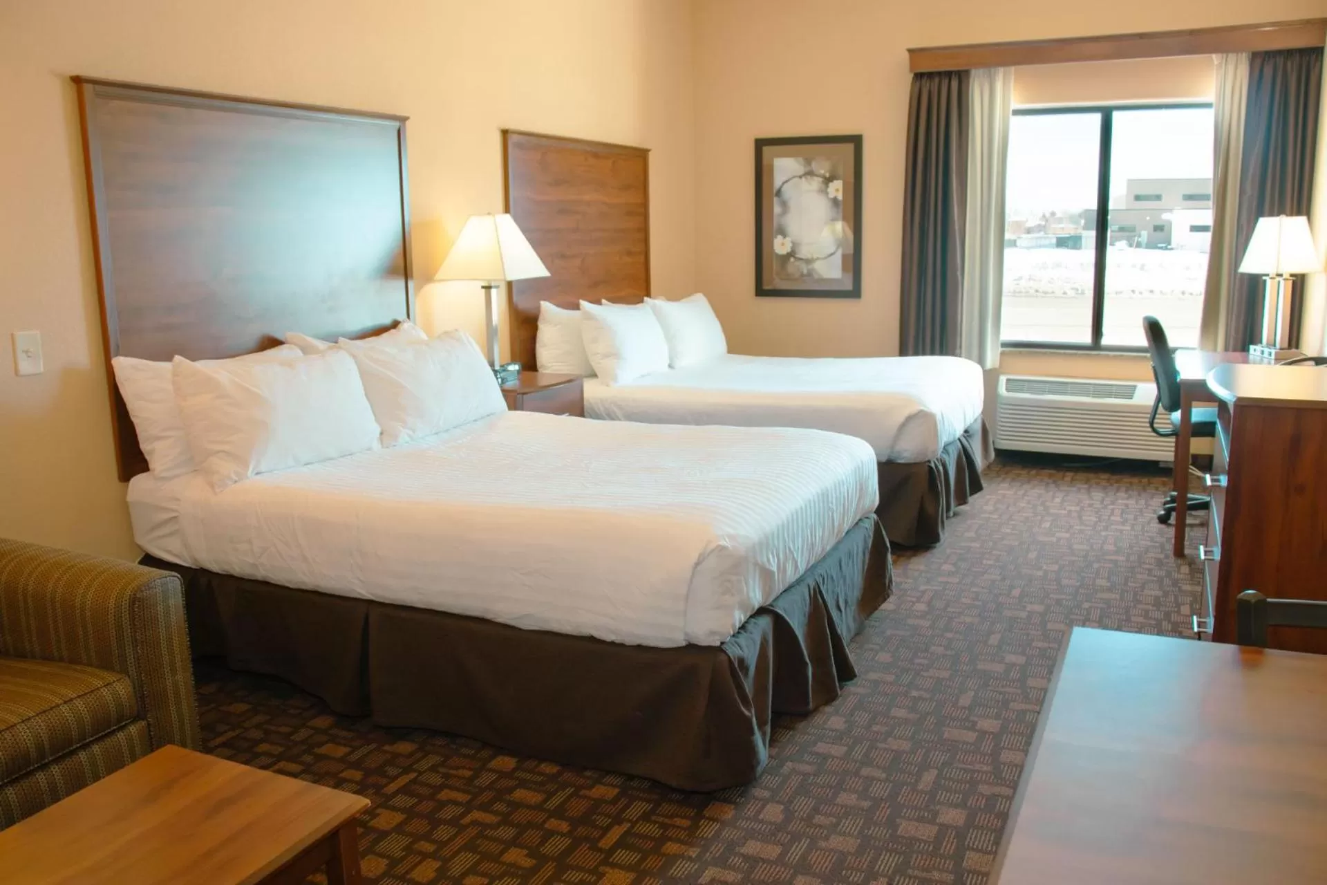 Bed in Grand Forks Lodge and Suites
