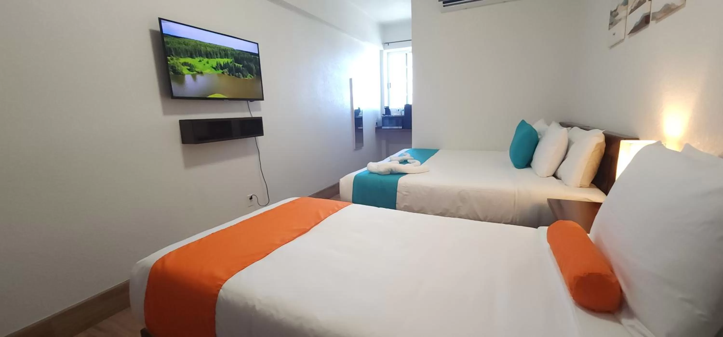 Bed in Voyager Sun & Reef Hotel