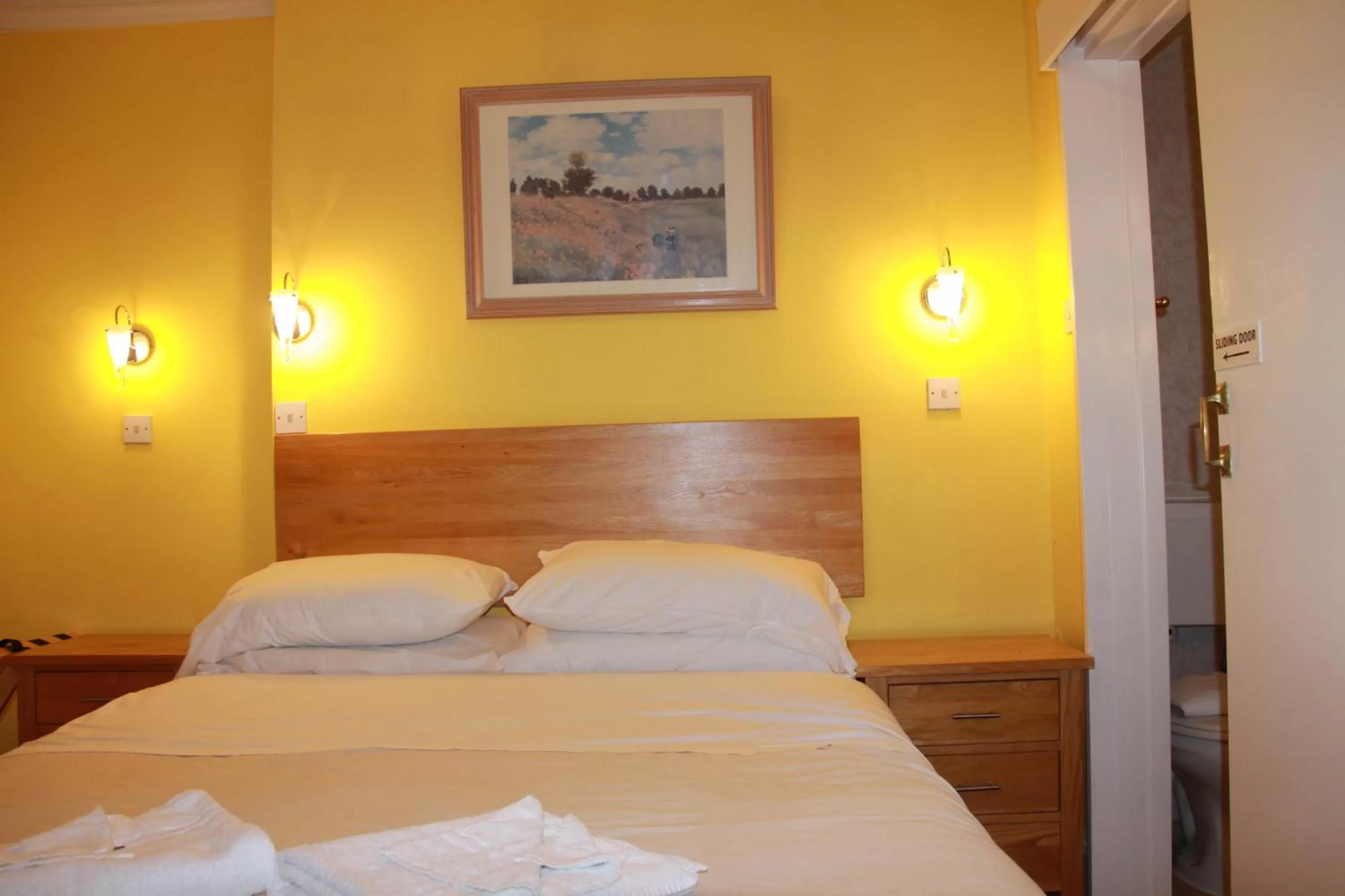 Bed in Ambassador Hotel