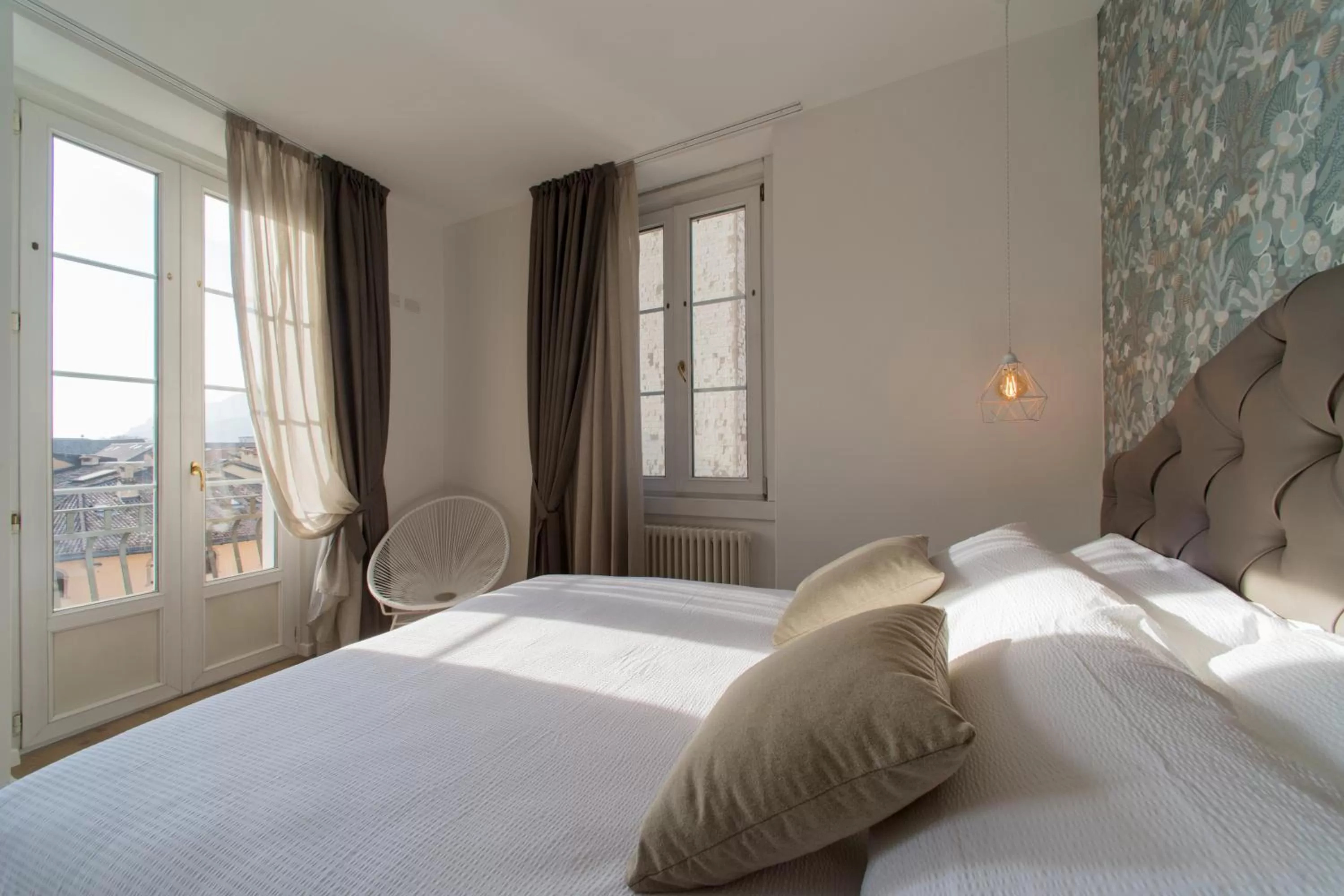 Bed in Lainez Rooms & Suites