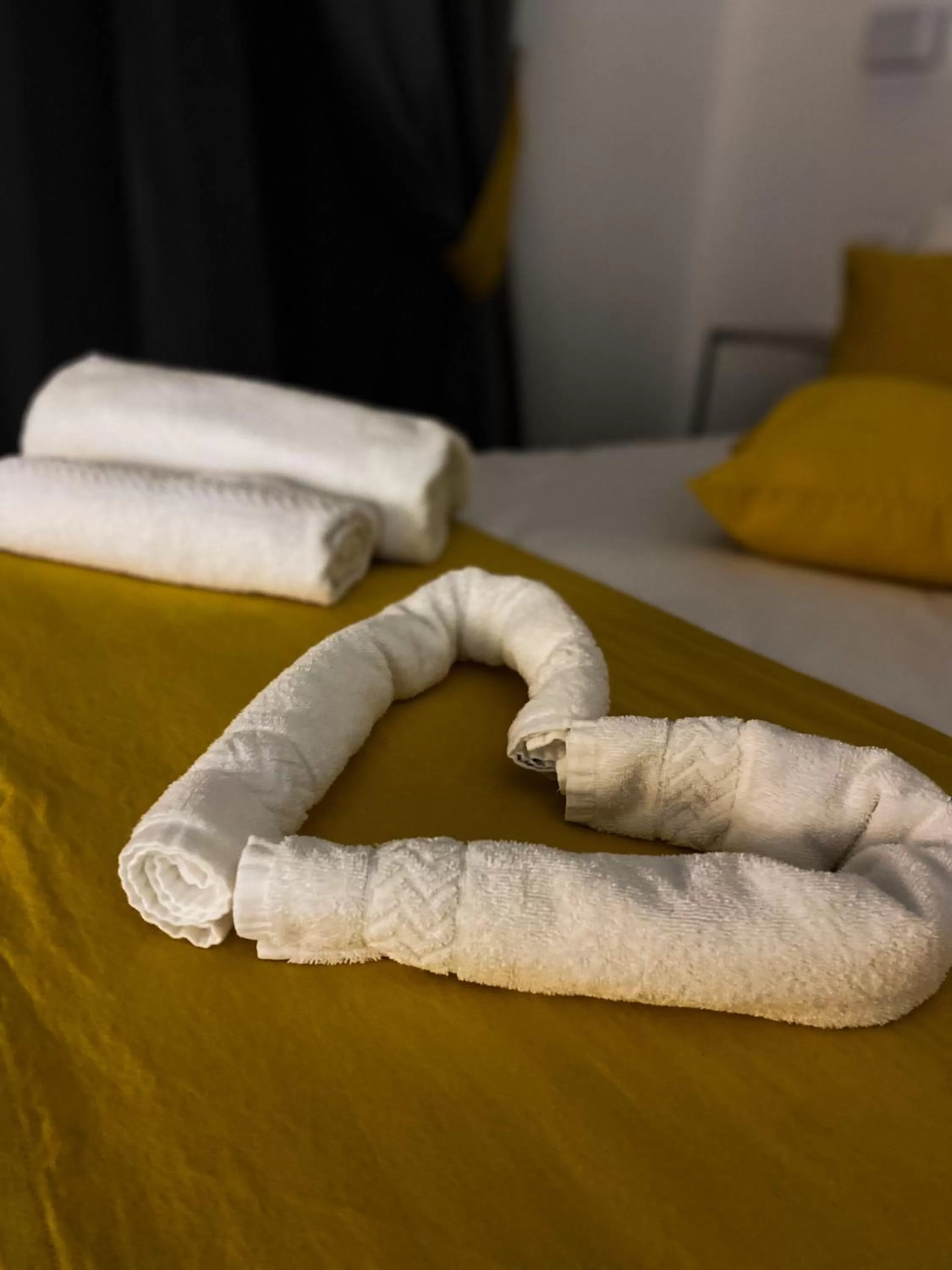 Bed in Megaris Luxury Suite Rooms