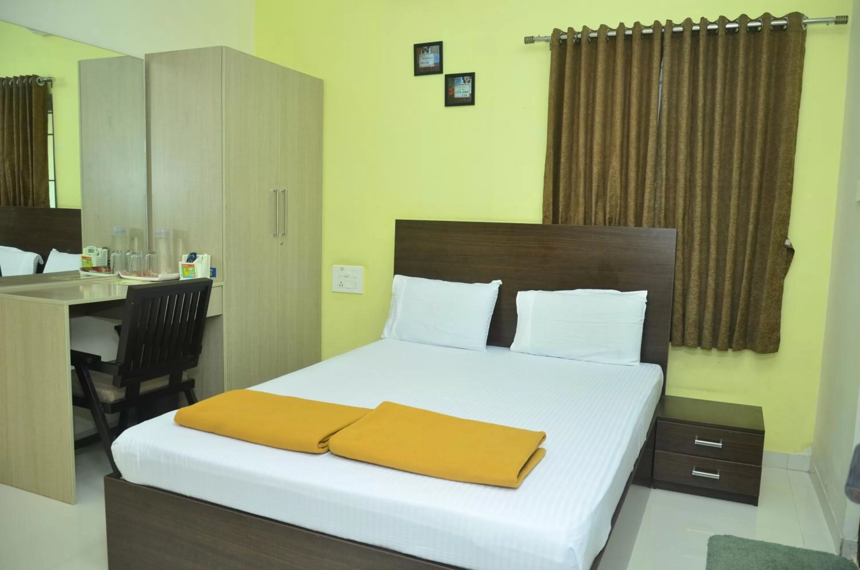 Bed in THE SURRYA MAX RESIDENCY