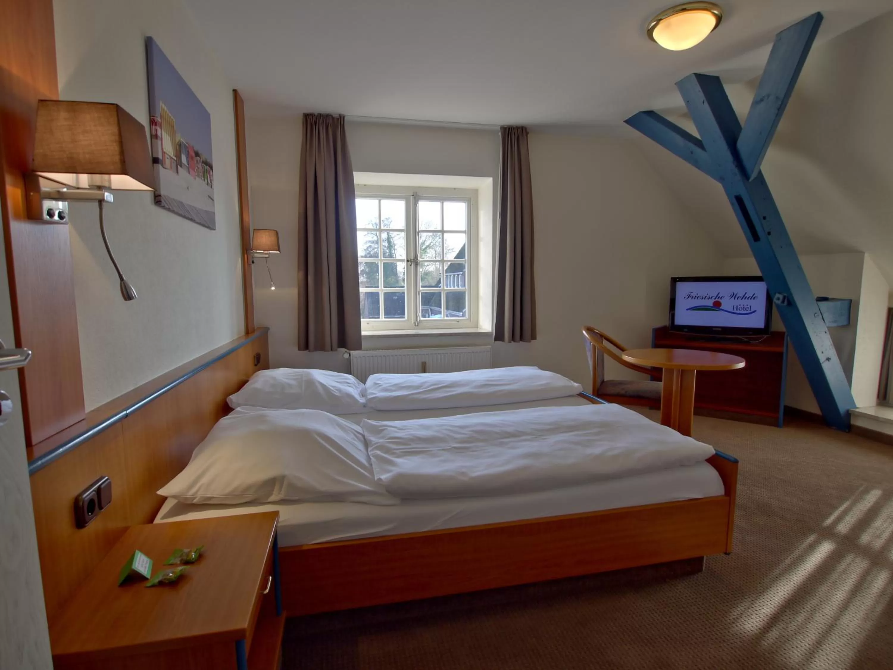 Bed in Hotel Friesische Wehde