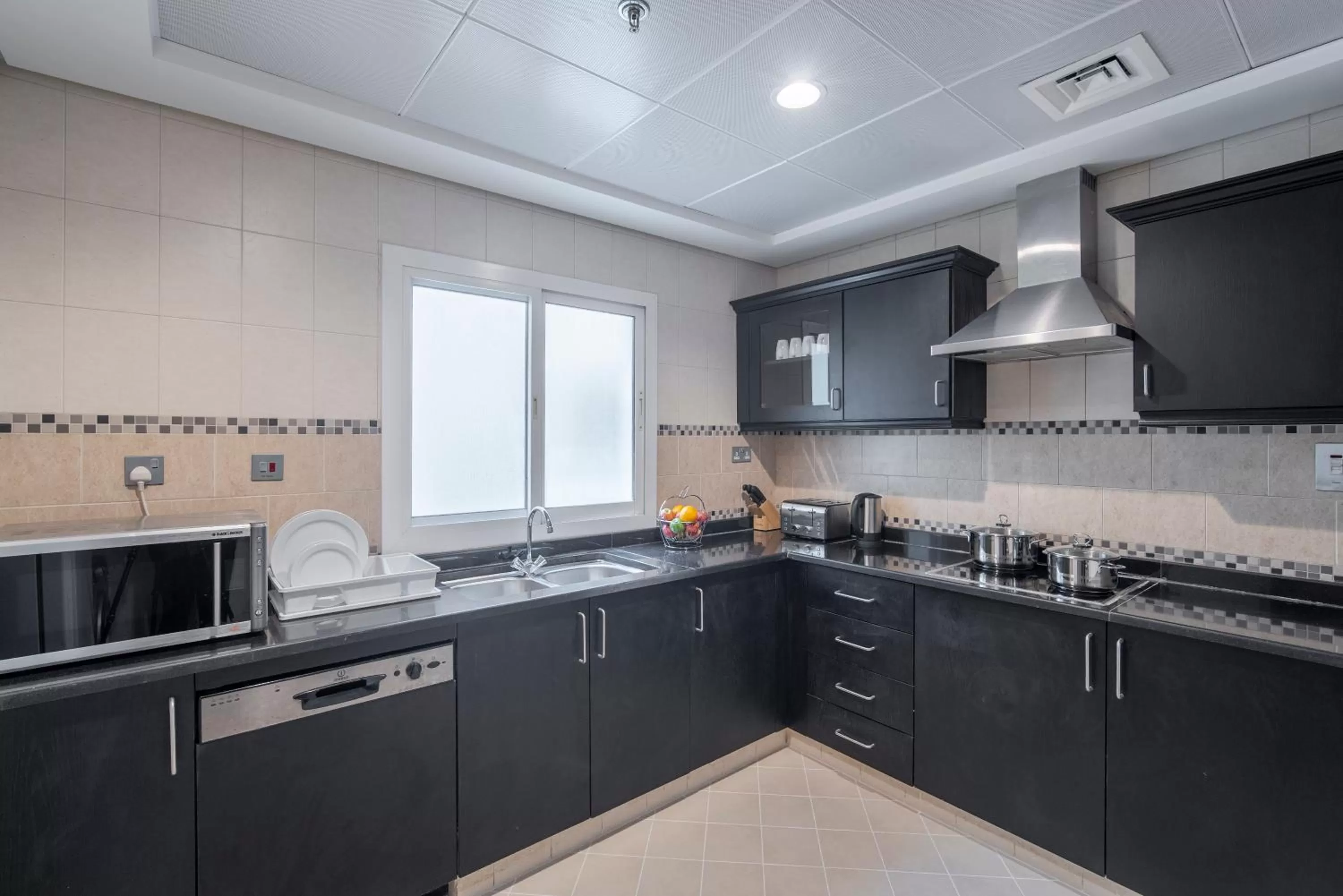 Kitchen or kitchenette in Rose Garden Hotel Apartments - Al Barsha, Near Metro Station