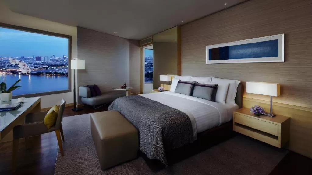 Bed in Avani Plus Riverside Bangkok Hotel