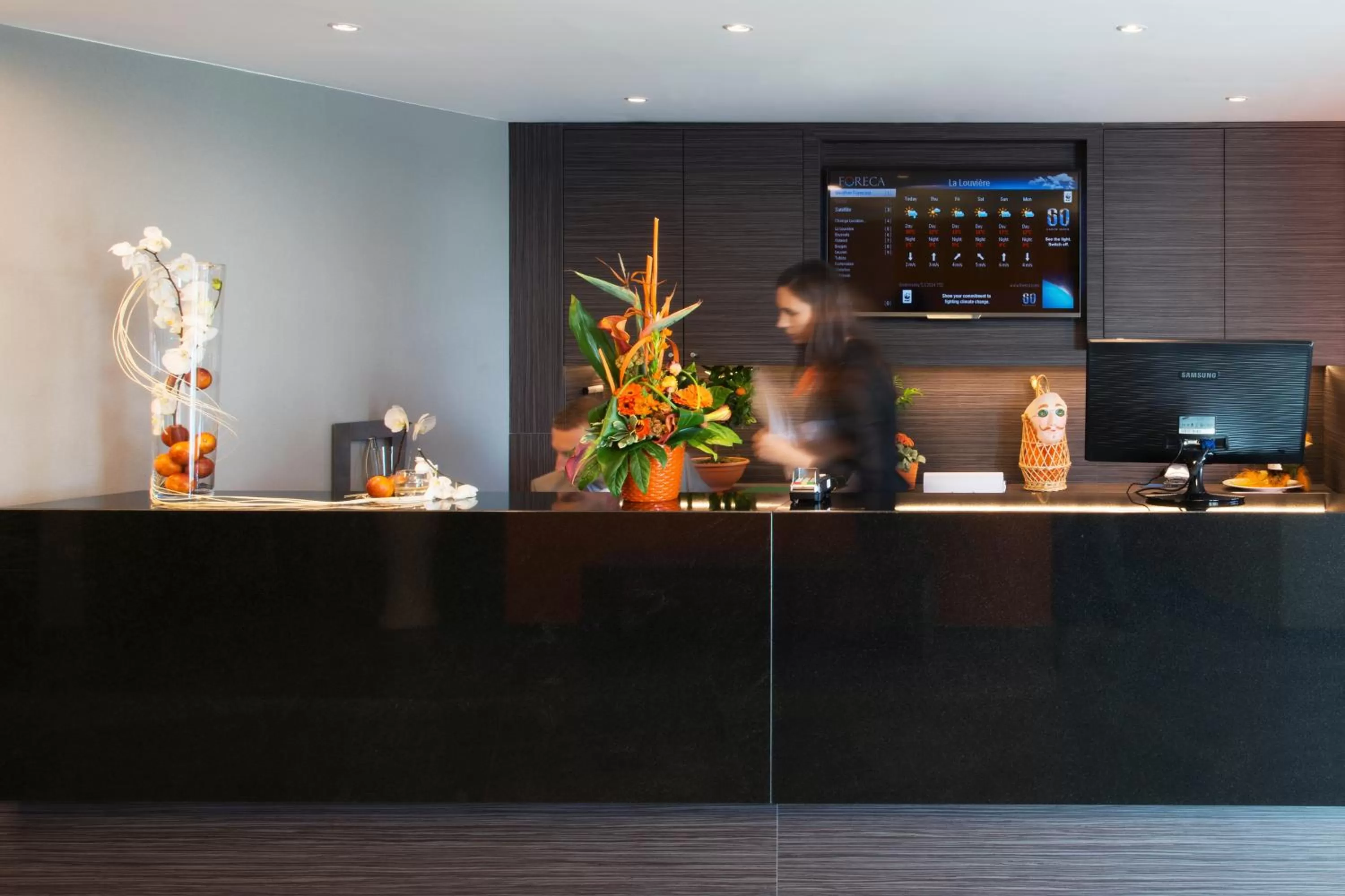 Staff in Orange Hotel La Louvière