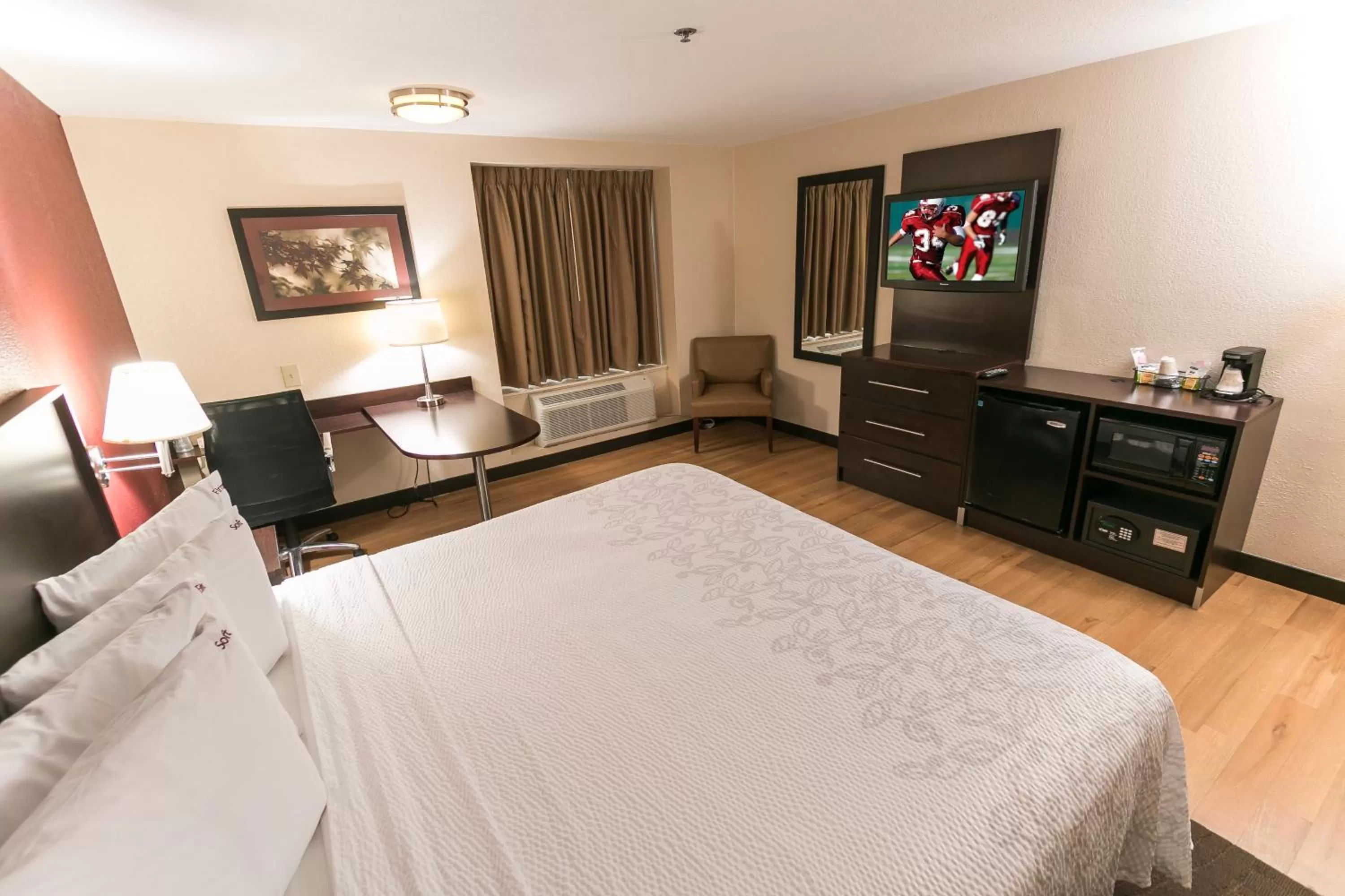 Photo of the whole room, Bed in Red Roof Inn PLUS Raleigh Downtown NCSU Conv Center