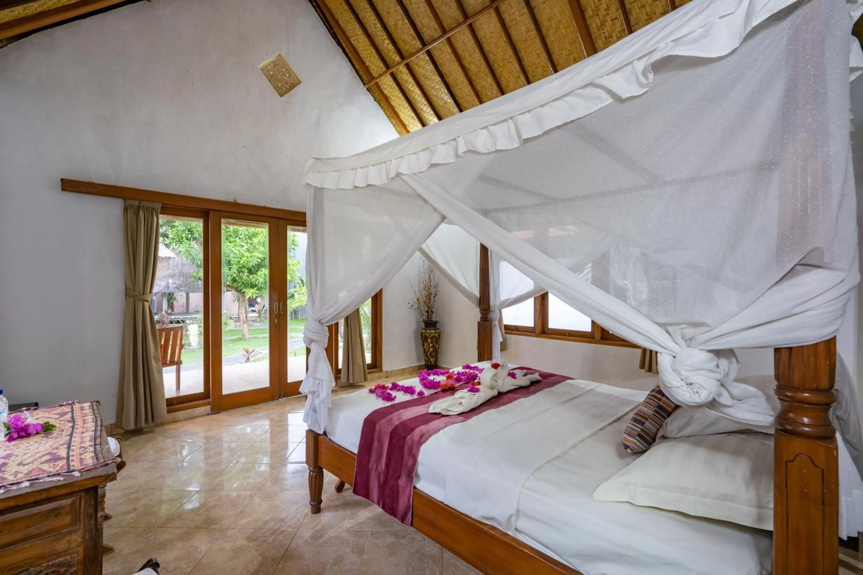 Bed in Mushroom Beach Bungalows