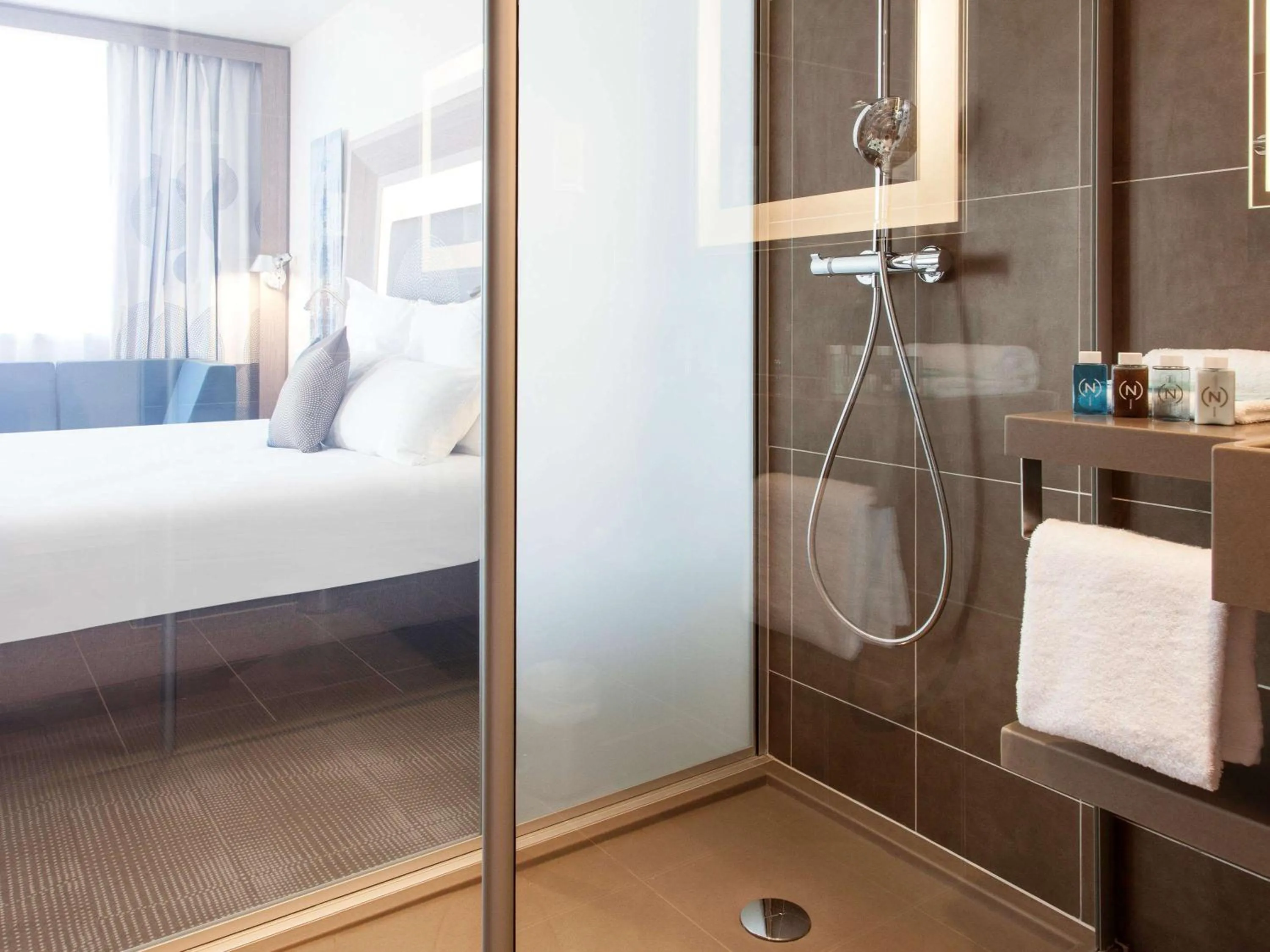 Photo of the whole room, Bed in Novotel Paris Saint Denis Stade Basilique