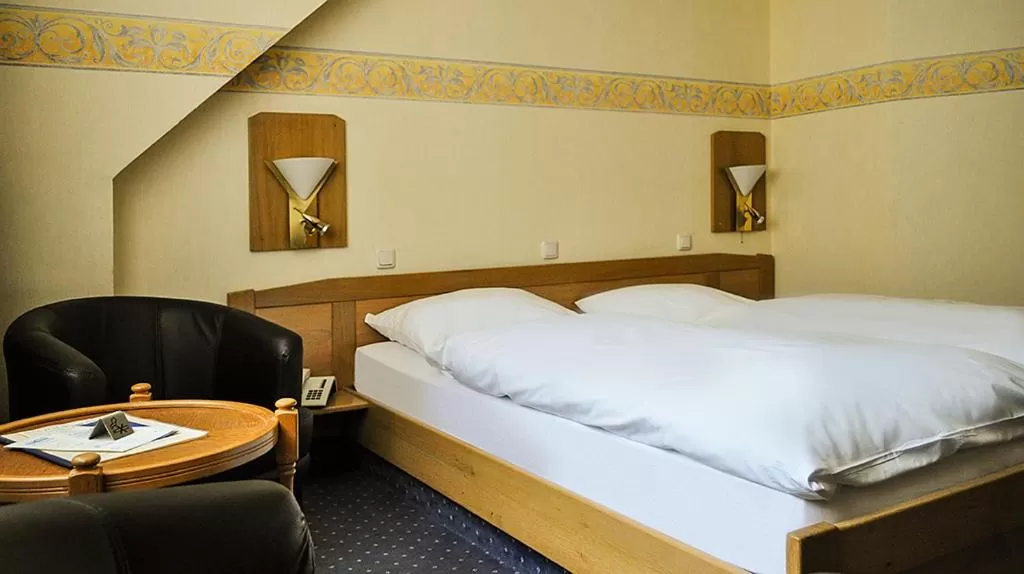 Bed in Hotel-Restaurant Schmachtenbergshof