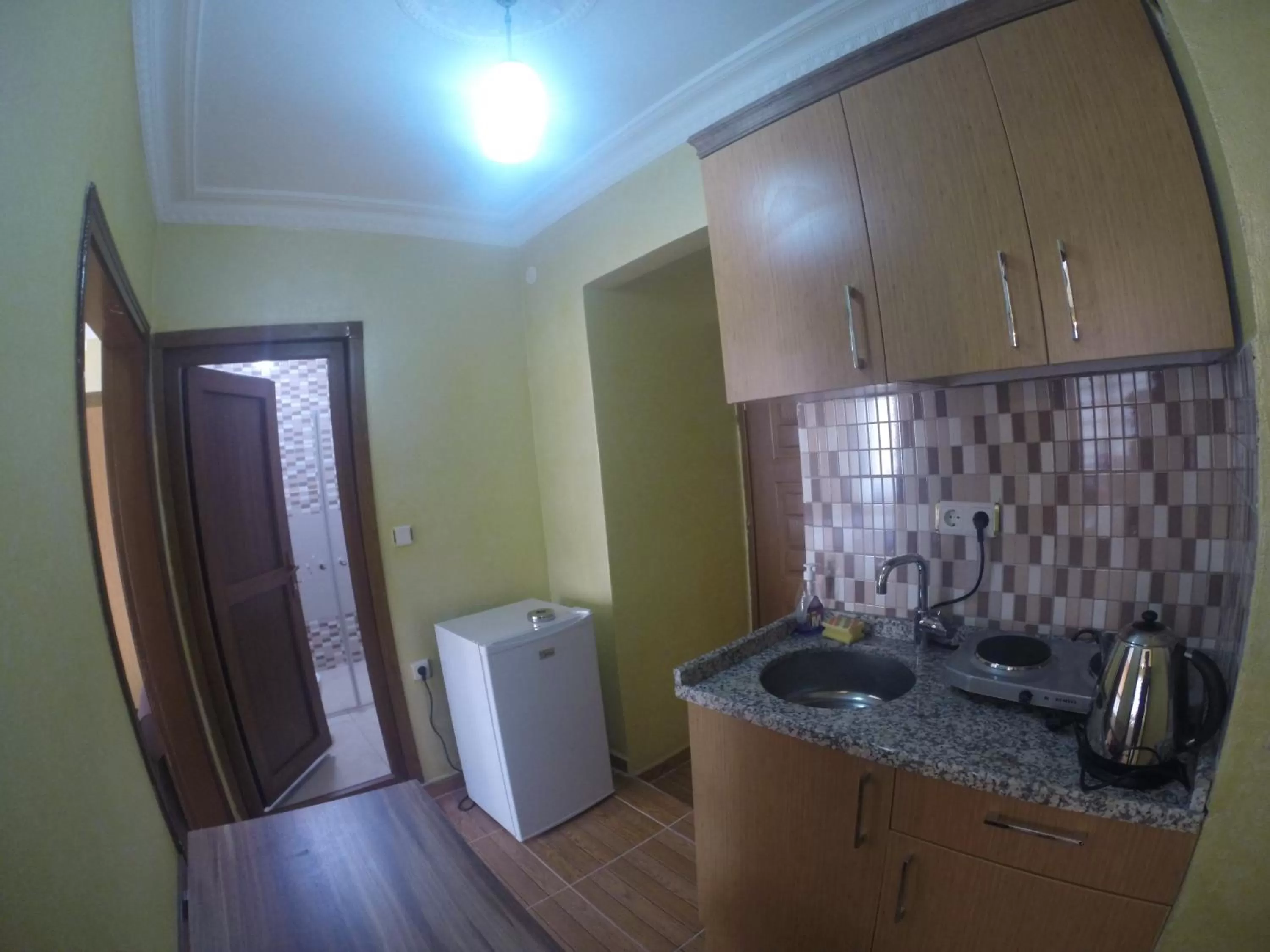 Coffee/tea facilities, Kitchen/Kitchenette in Arat Apartments