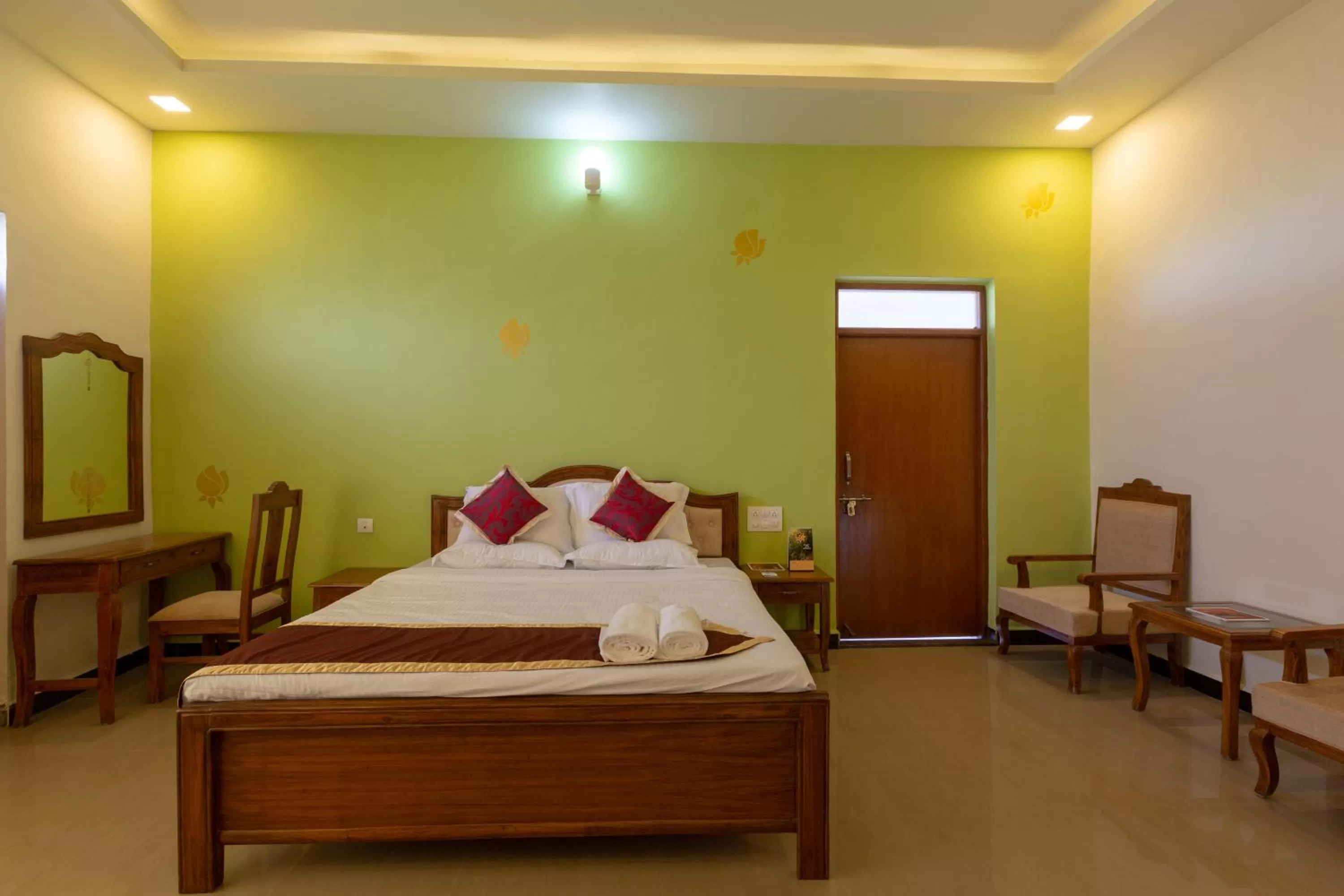 Bed in KSTDC Hotel Mayura Krishna Almatti