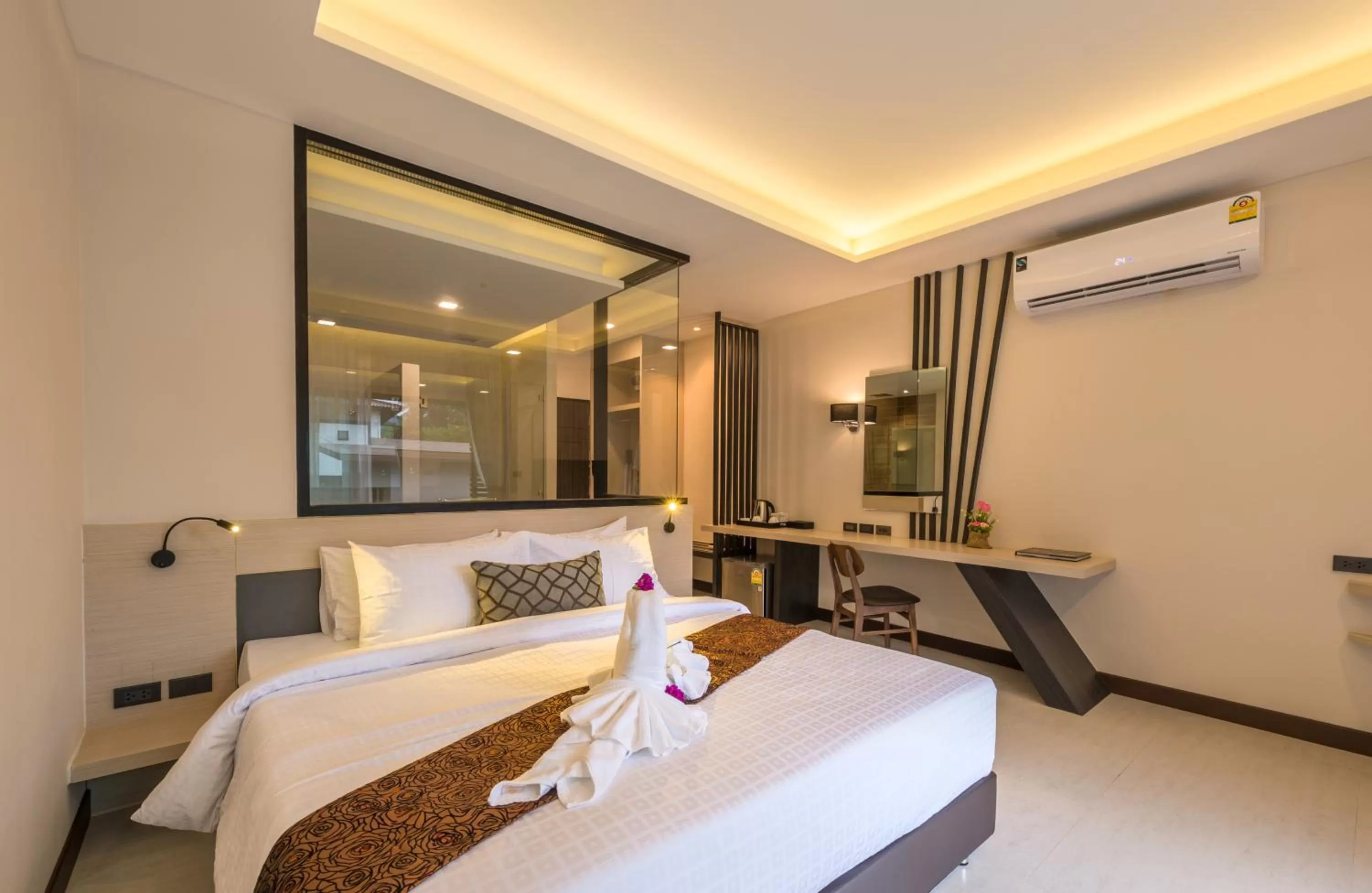 Bed in Cher​mantra​ Aonang​ Resort & Pool​ Suite