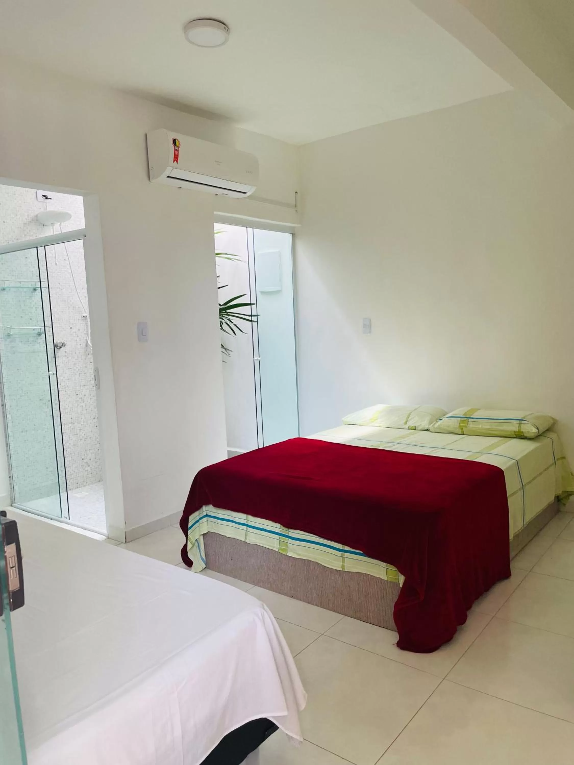 Bed in Pousada Praia do Tombo