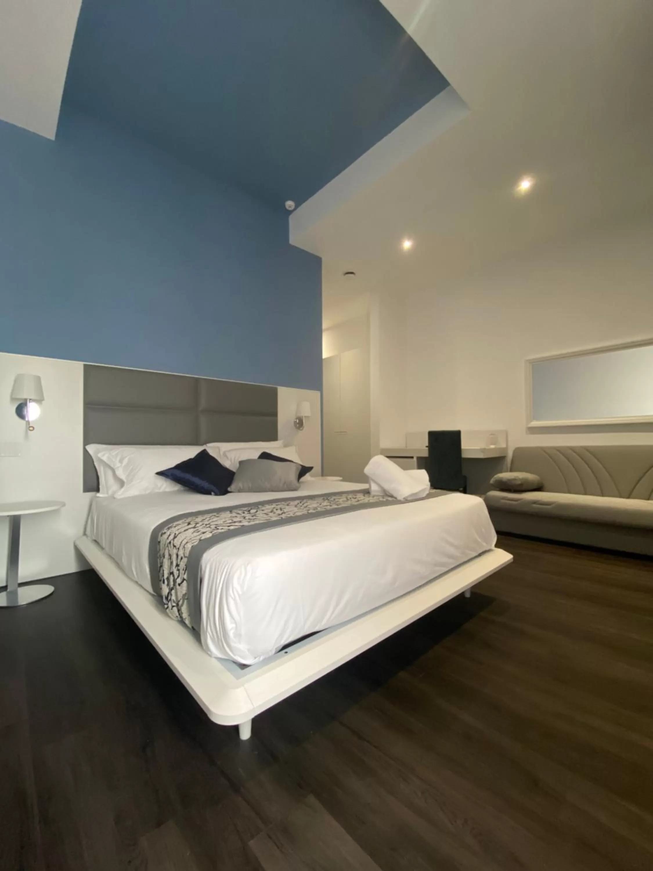 Bed in Palazzo Cappuccini Art Relais