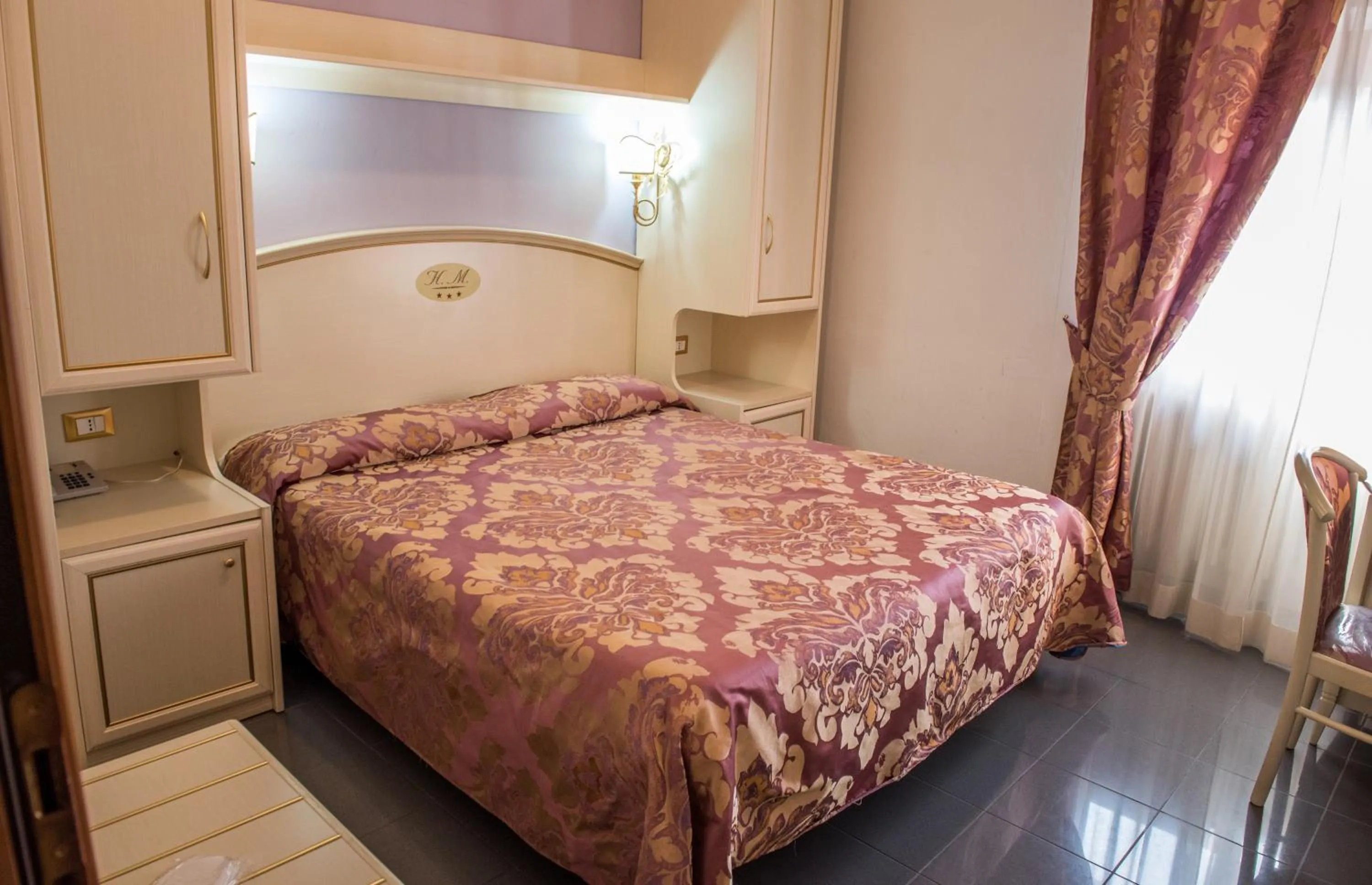 Bed in Hotel La Meridiana