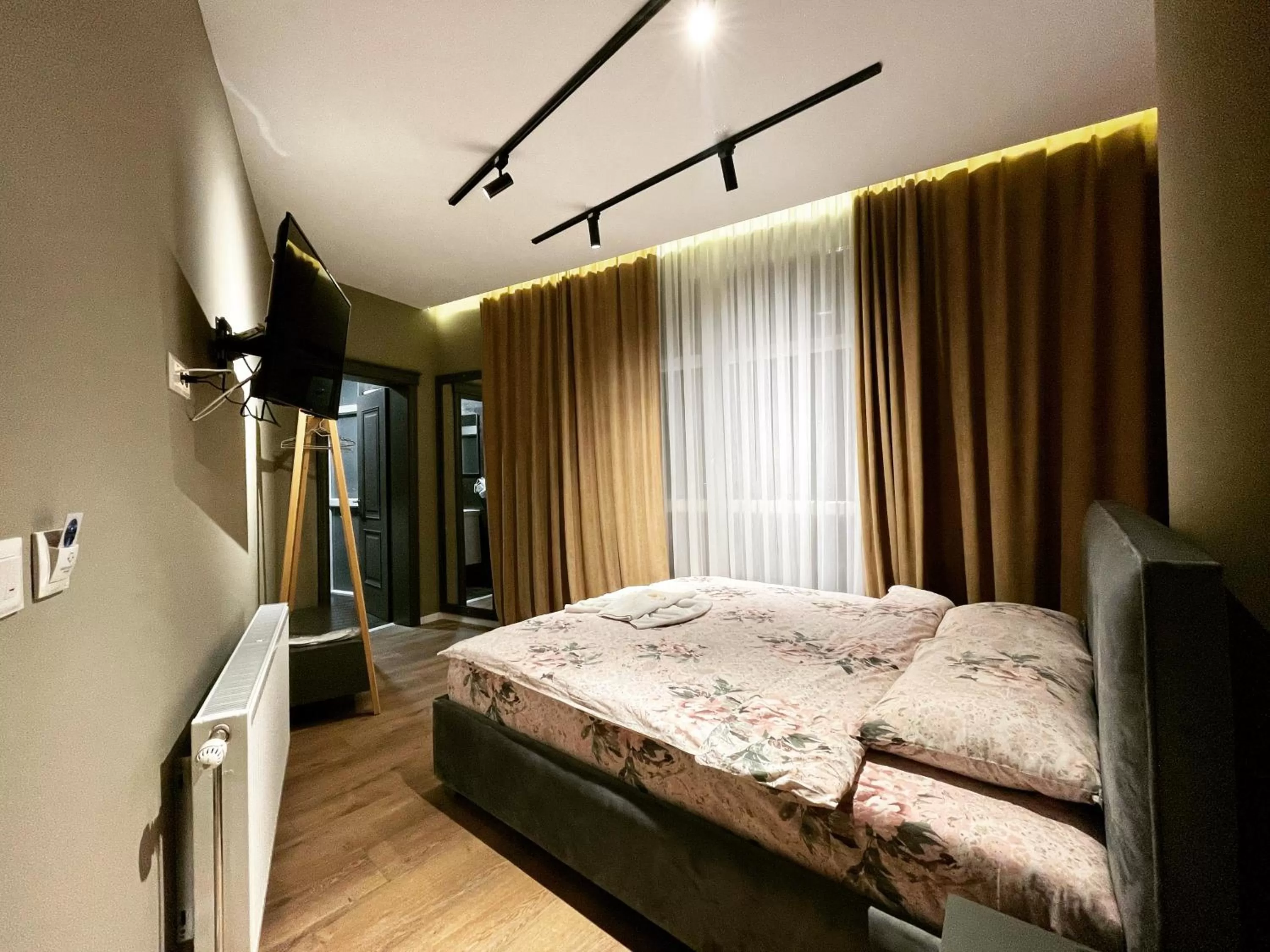 Bed in GRAND JNK Boutique Hotel