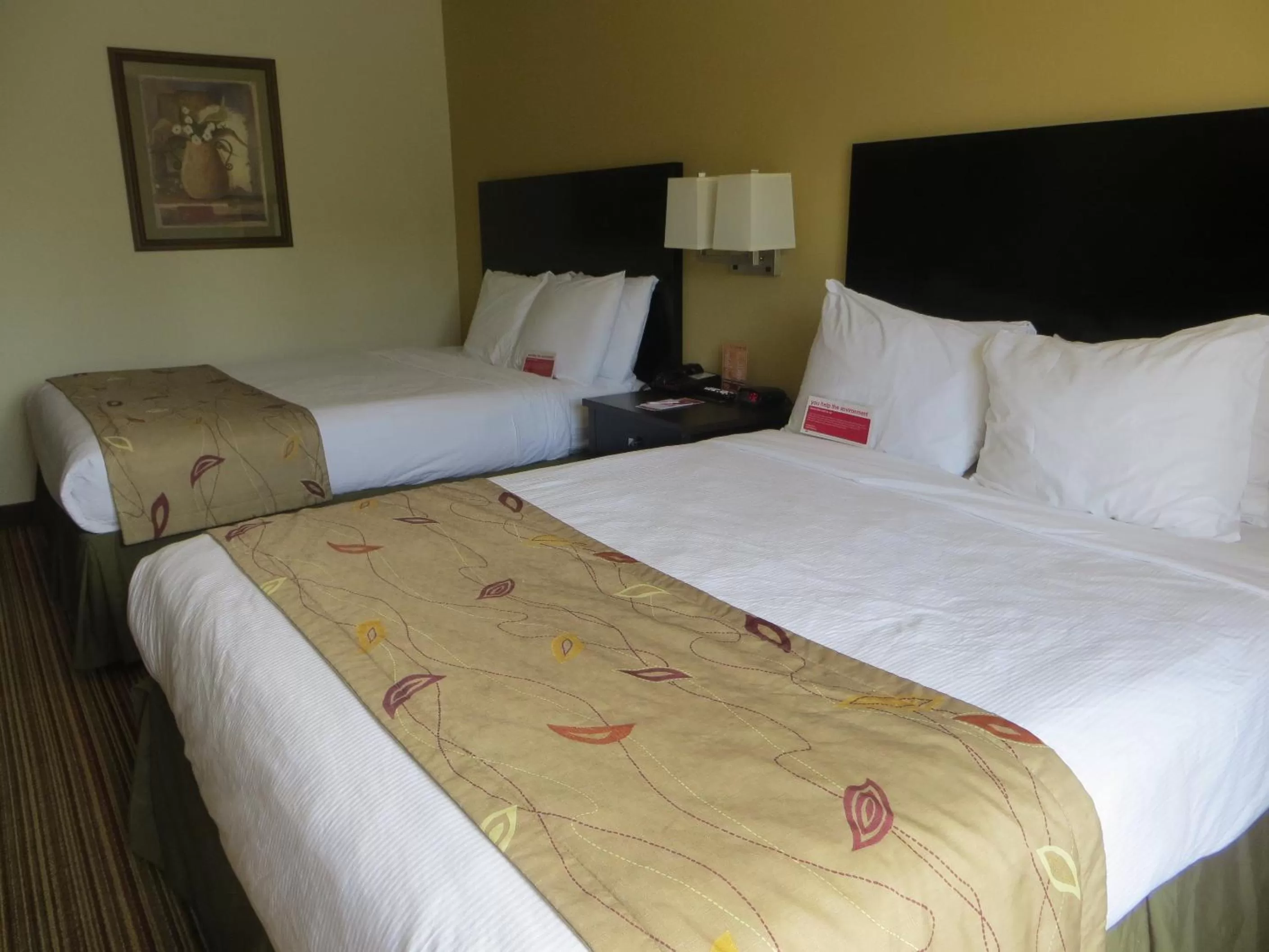 Bed in Ramada by Wyndham Wisconsin Dells I-90