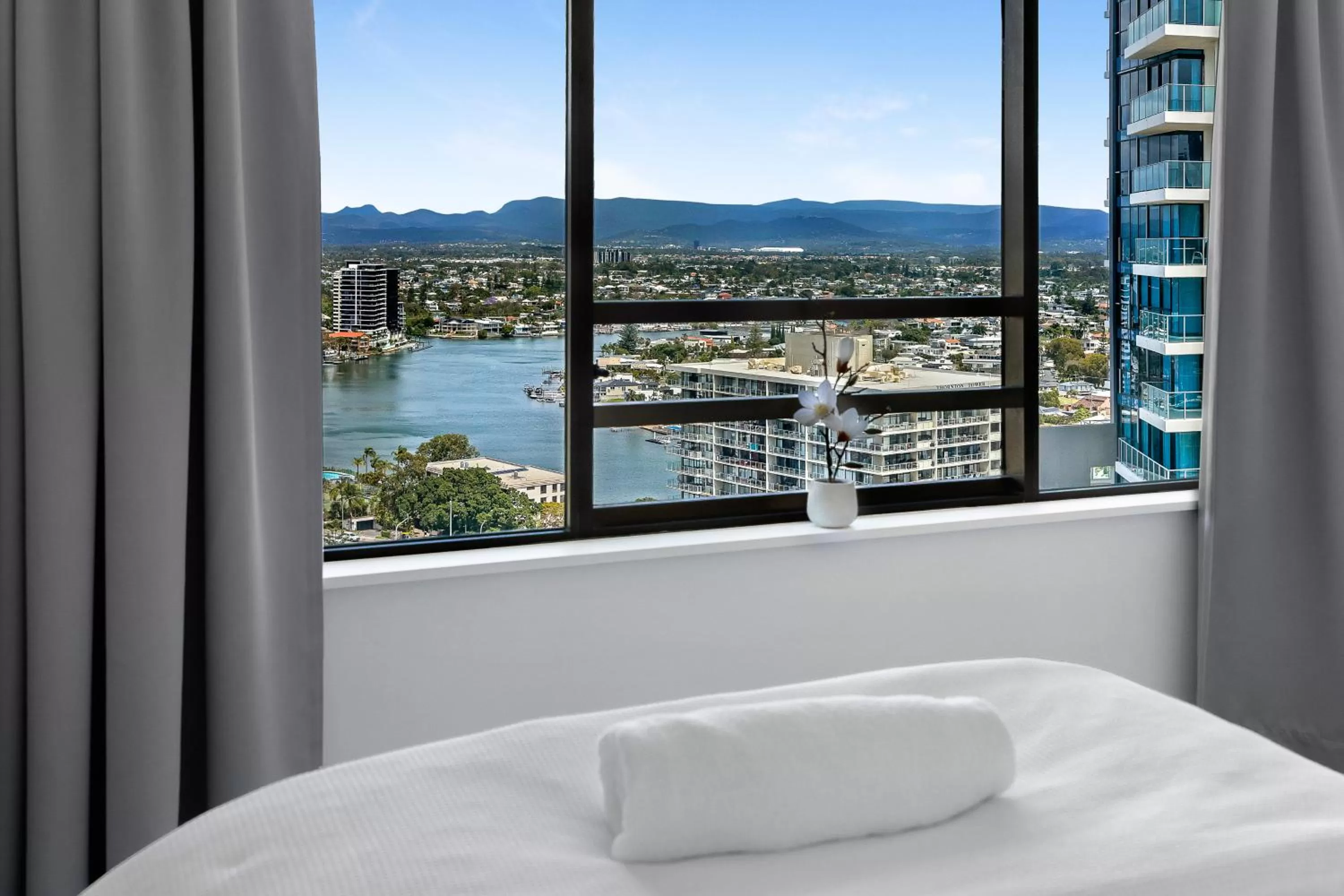 Bed in Surfers Century Oceanside Apartments