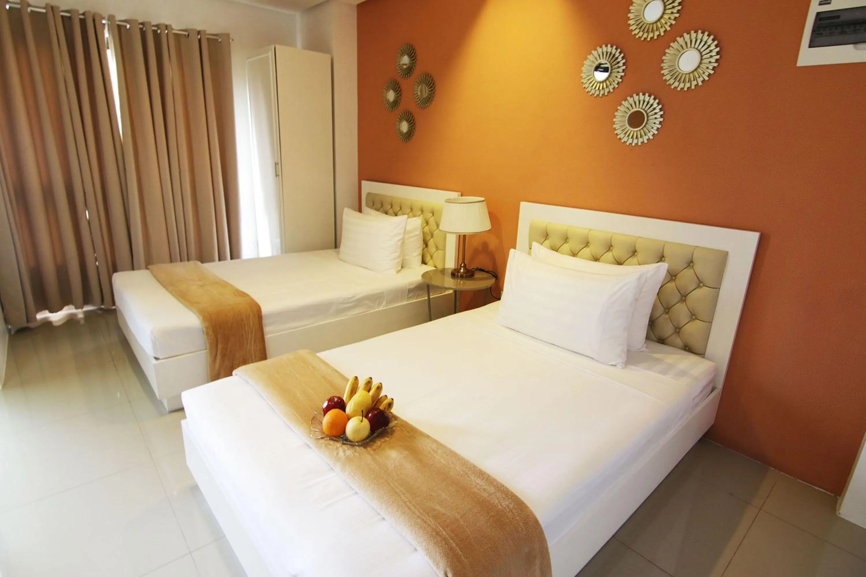 Bed in Baymont Suites & Residences