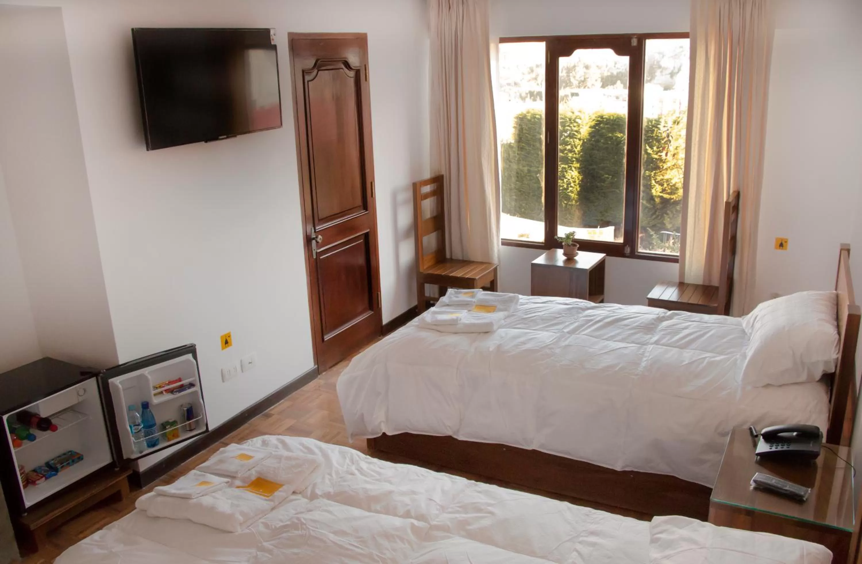 Bed in Qhini Hotel Boutique