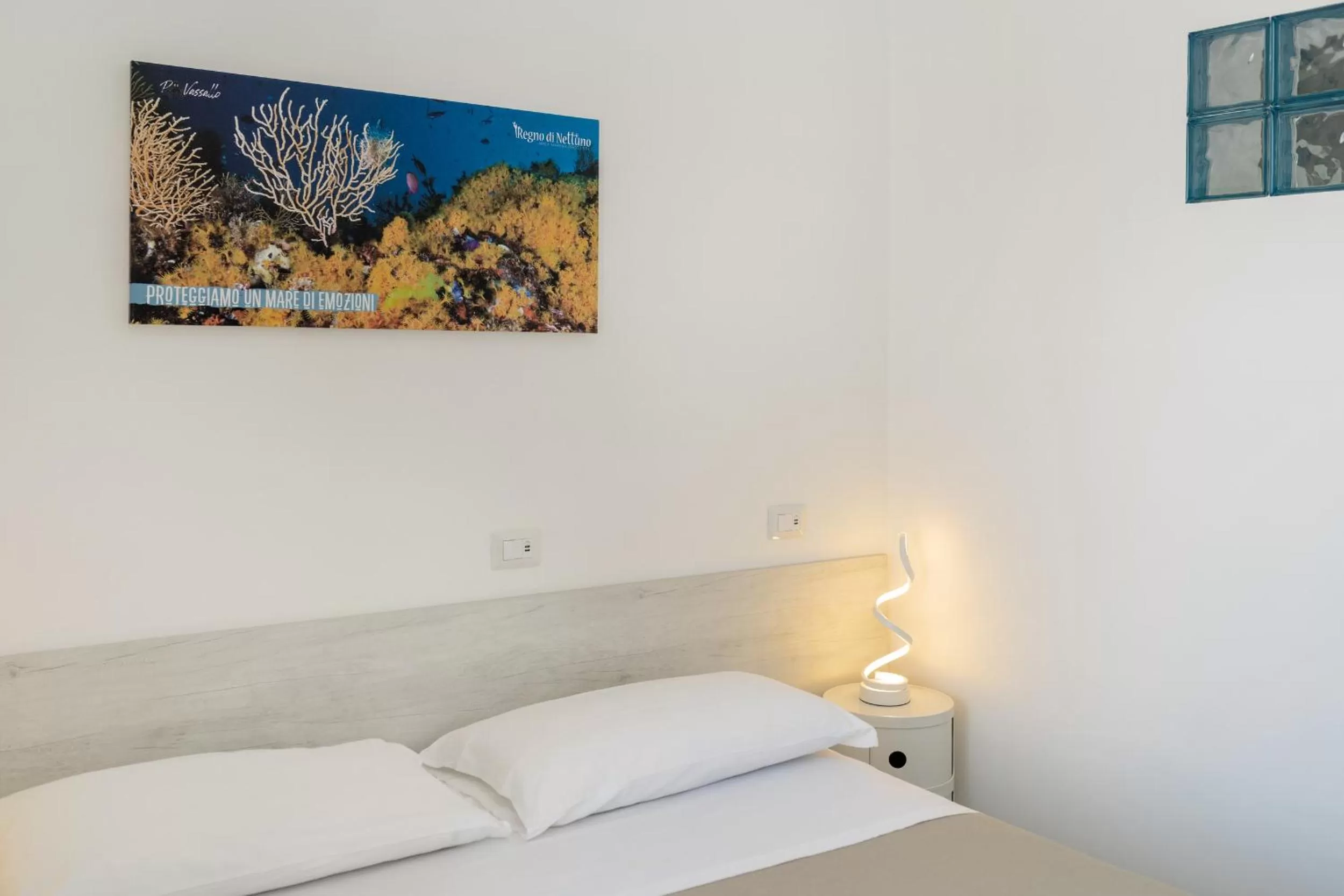 Decorative detail, Bed in Poseidonia Rooms