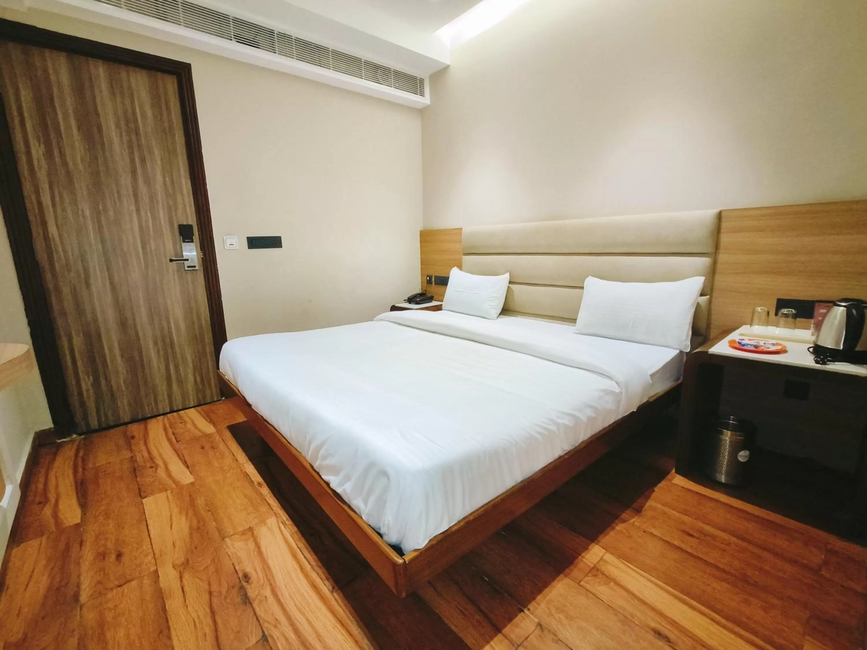 Bed in Aura Rooms