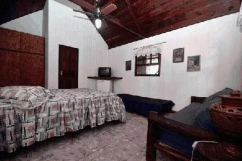 Bed in Pousada A Marca do Faraó