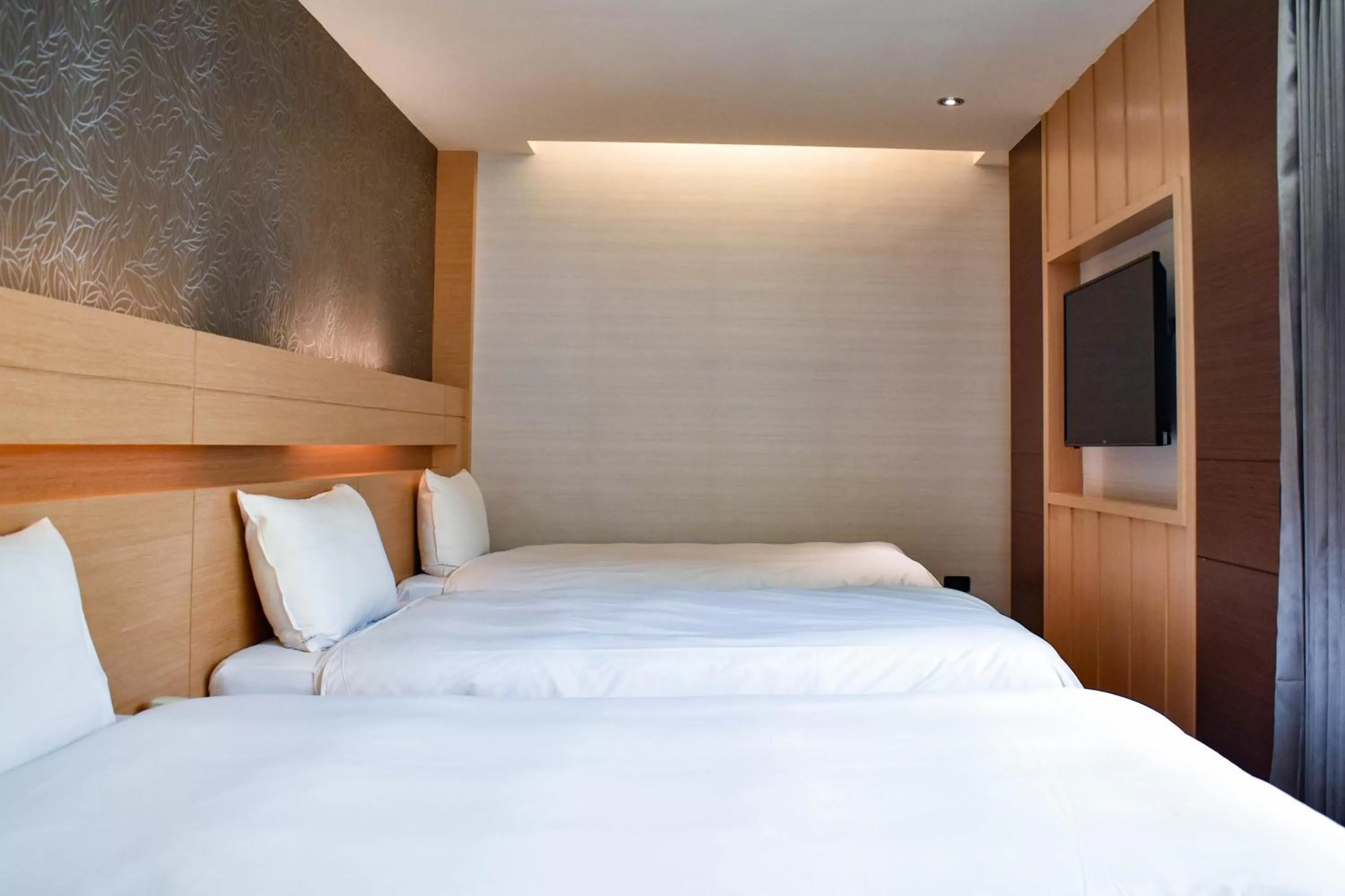 Photo of the whole room, Bed in Talmud Hotel Tainan