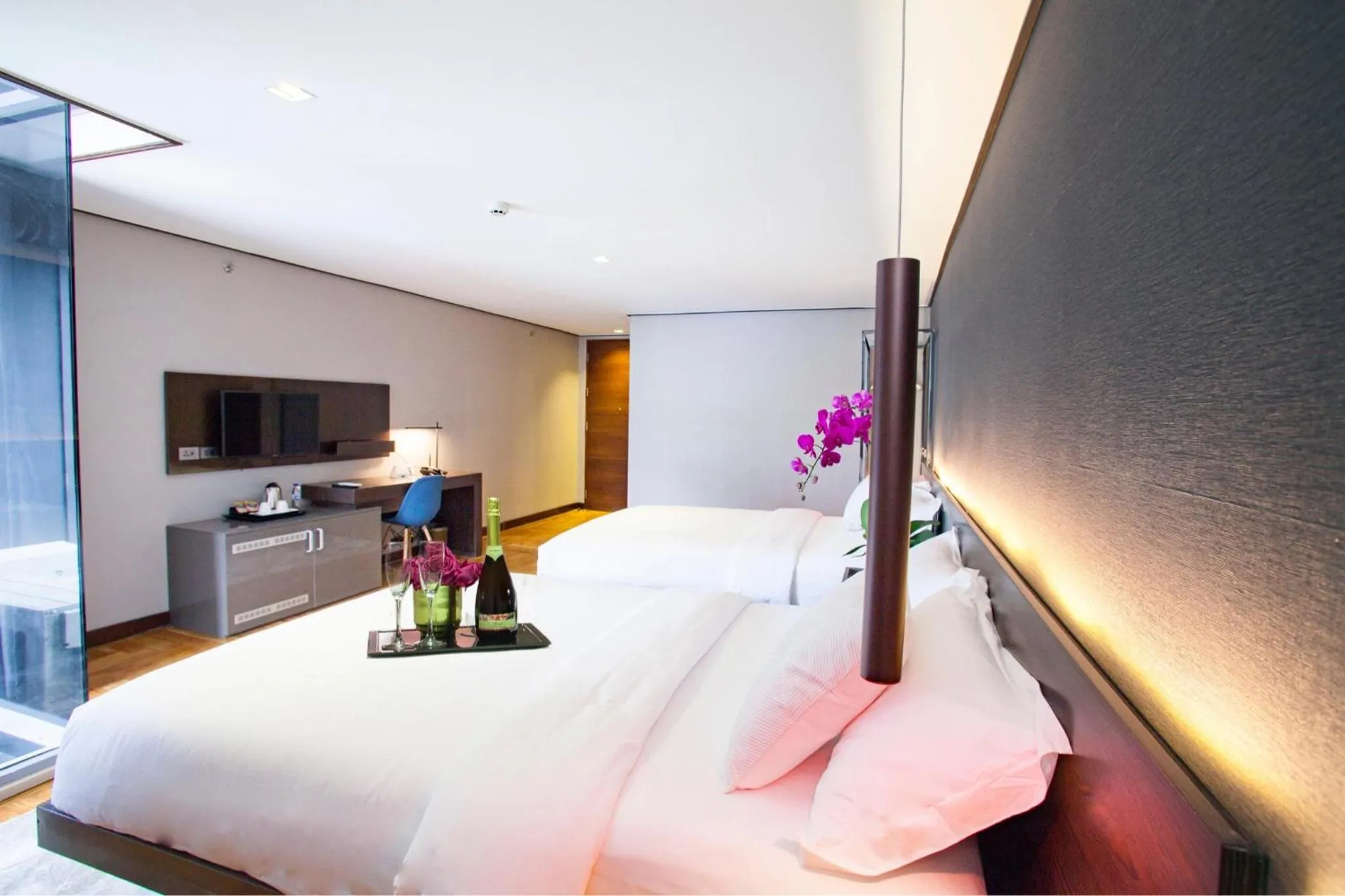 Bed in Ramada Encore by Wyndham Makati