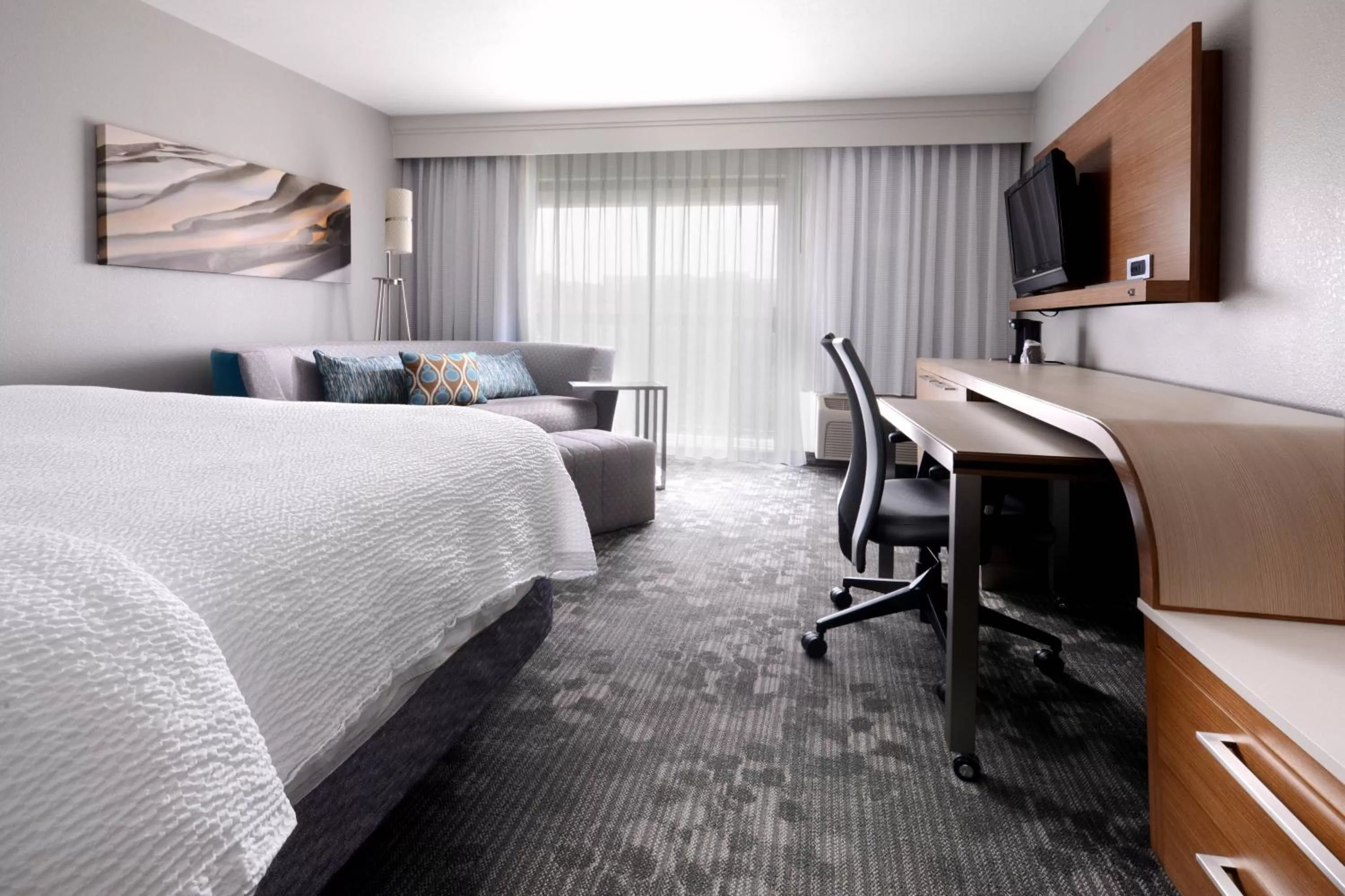 King Room with Sofa Bed and Balcony - Hearing Accessible in Courtyard by Marriott Houston Northwest