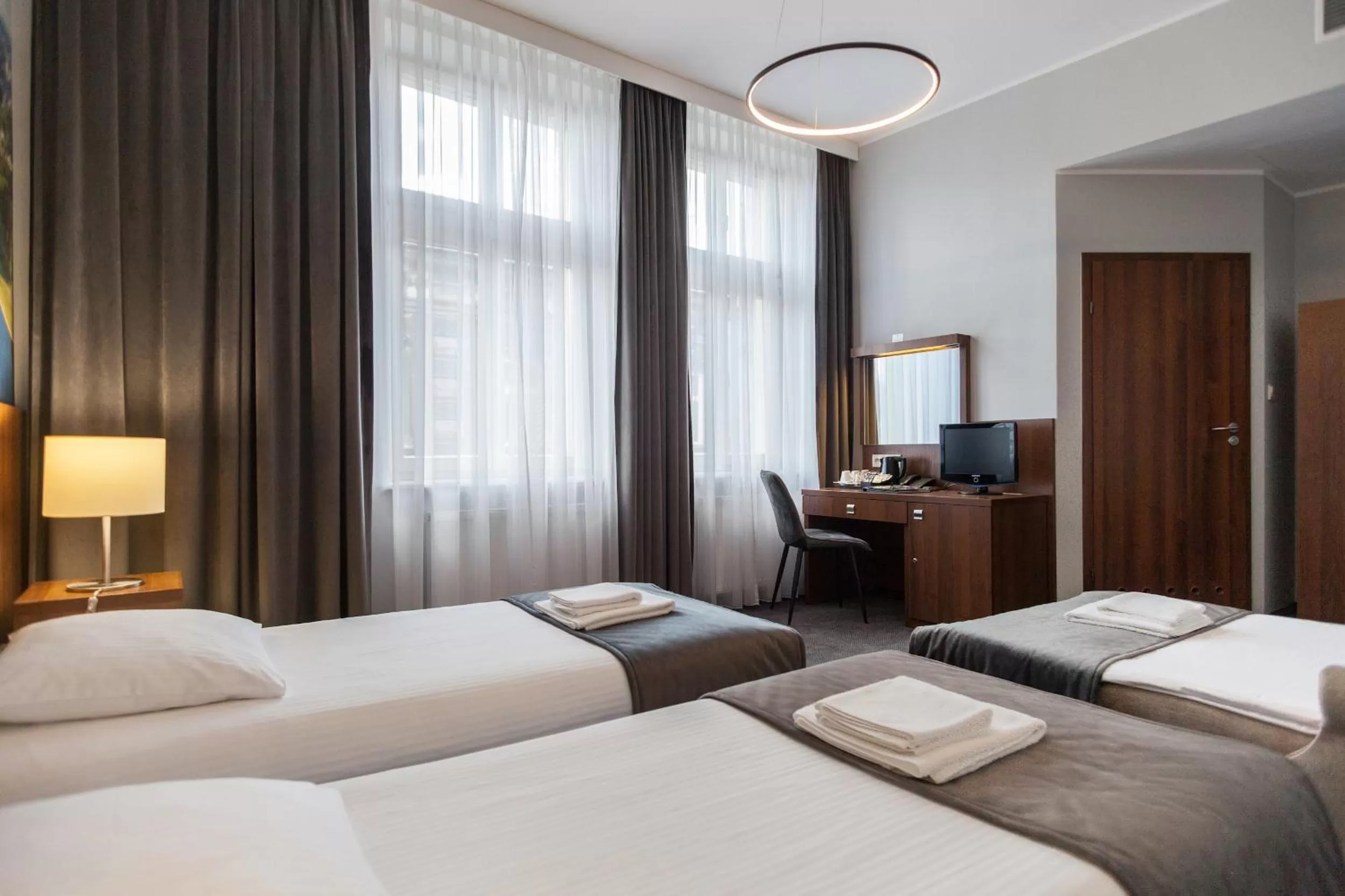 Bed in Hotel Downtown Kraków