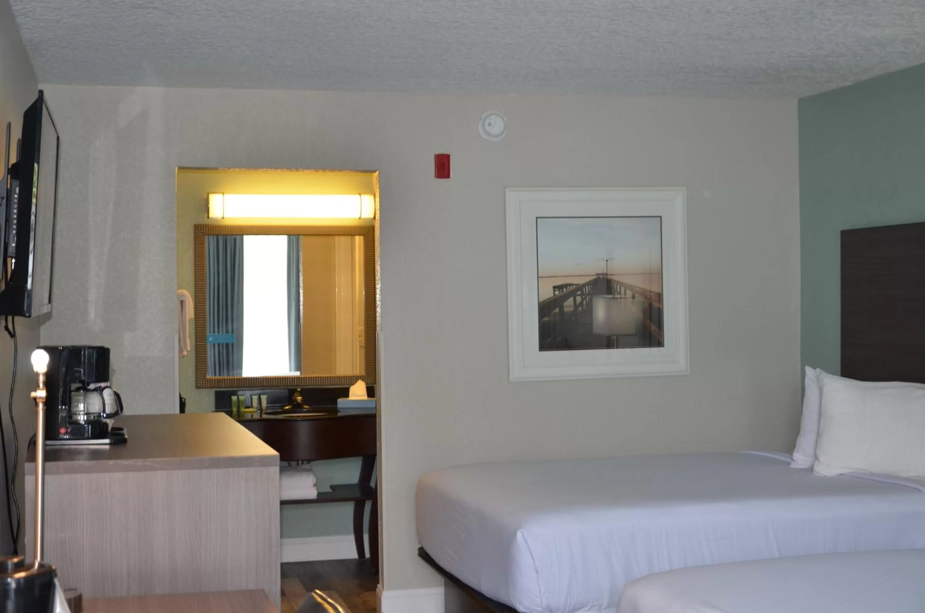 Bed in Opal Hotel & Suites