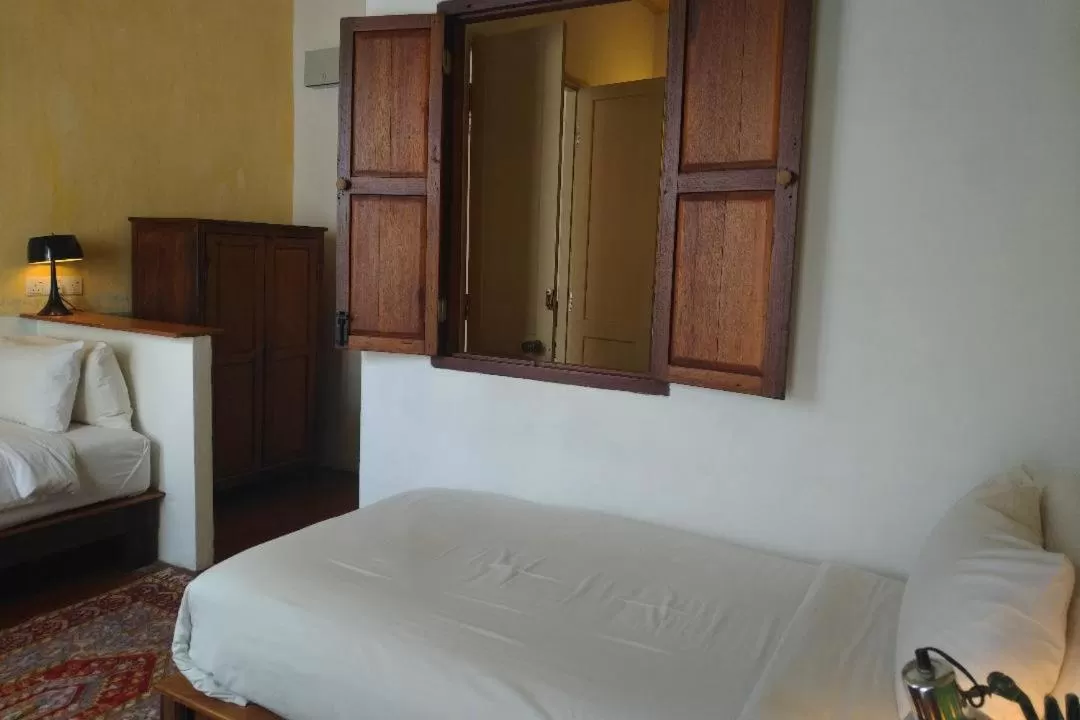 Bed in Ren I Tang Heritage Inn